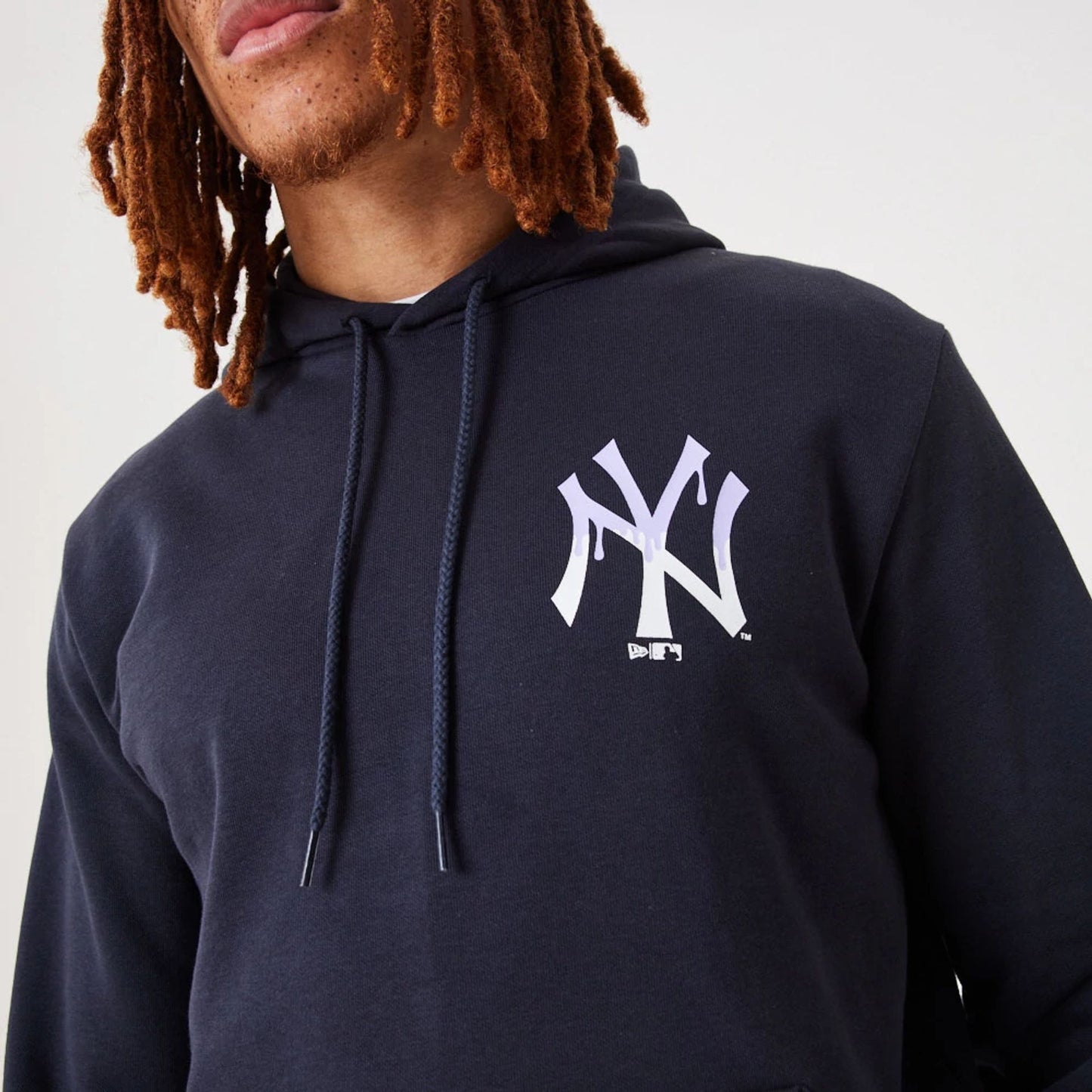 The Male model is wearing New York Yankees MLB Drip Logo Navy Pullover Hoodie 5