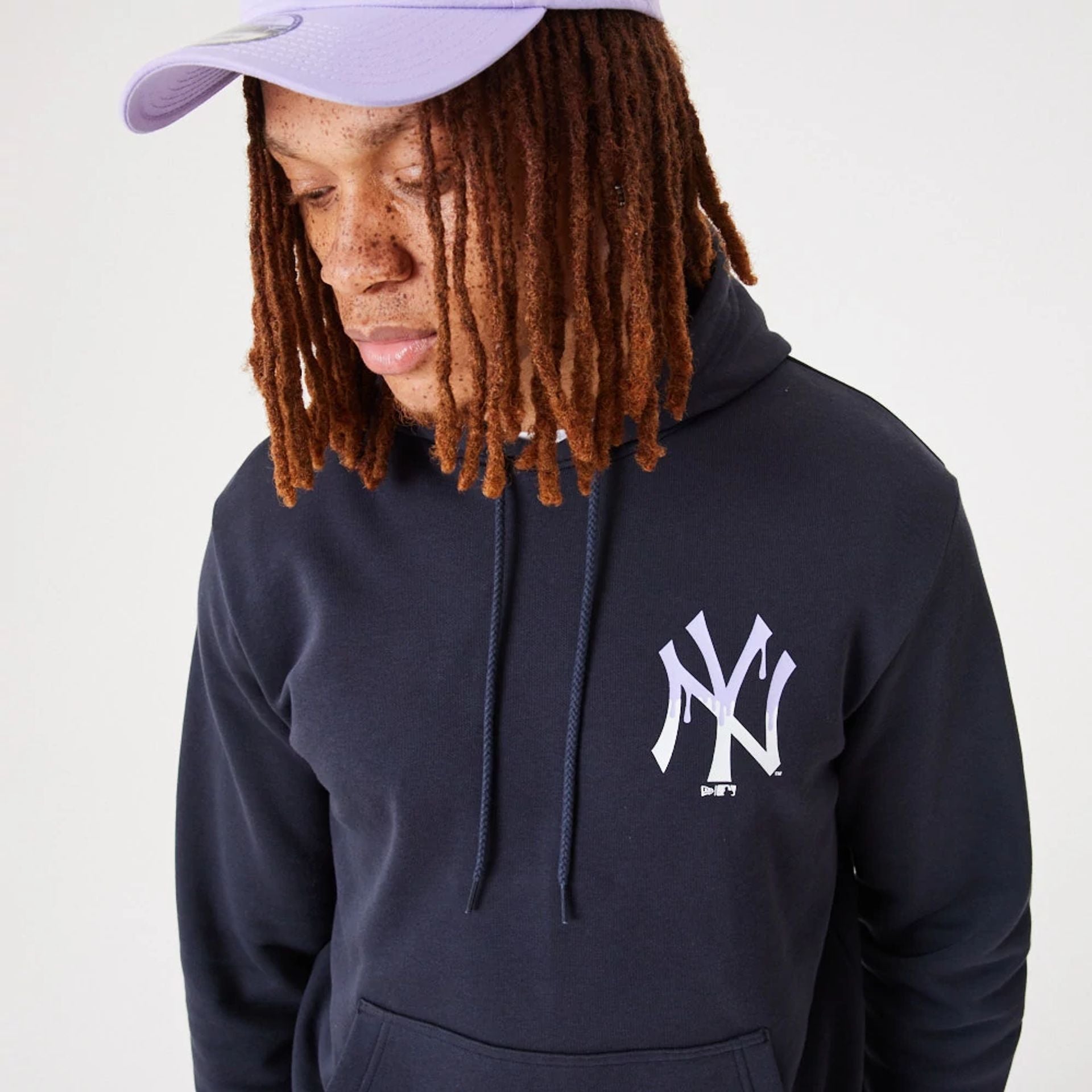 The Male model is wearing New York Yankees MLB Drip Logo Navy Pullover Hoodie 7