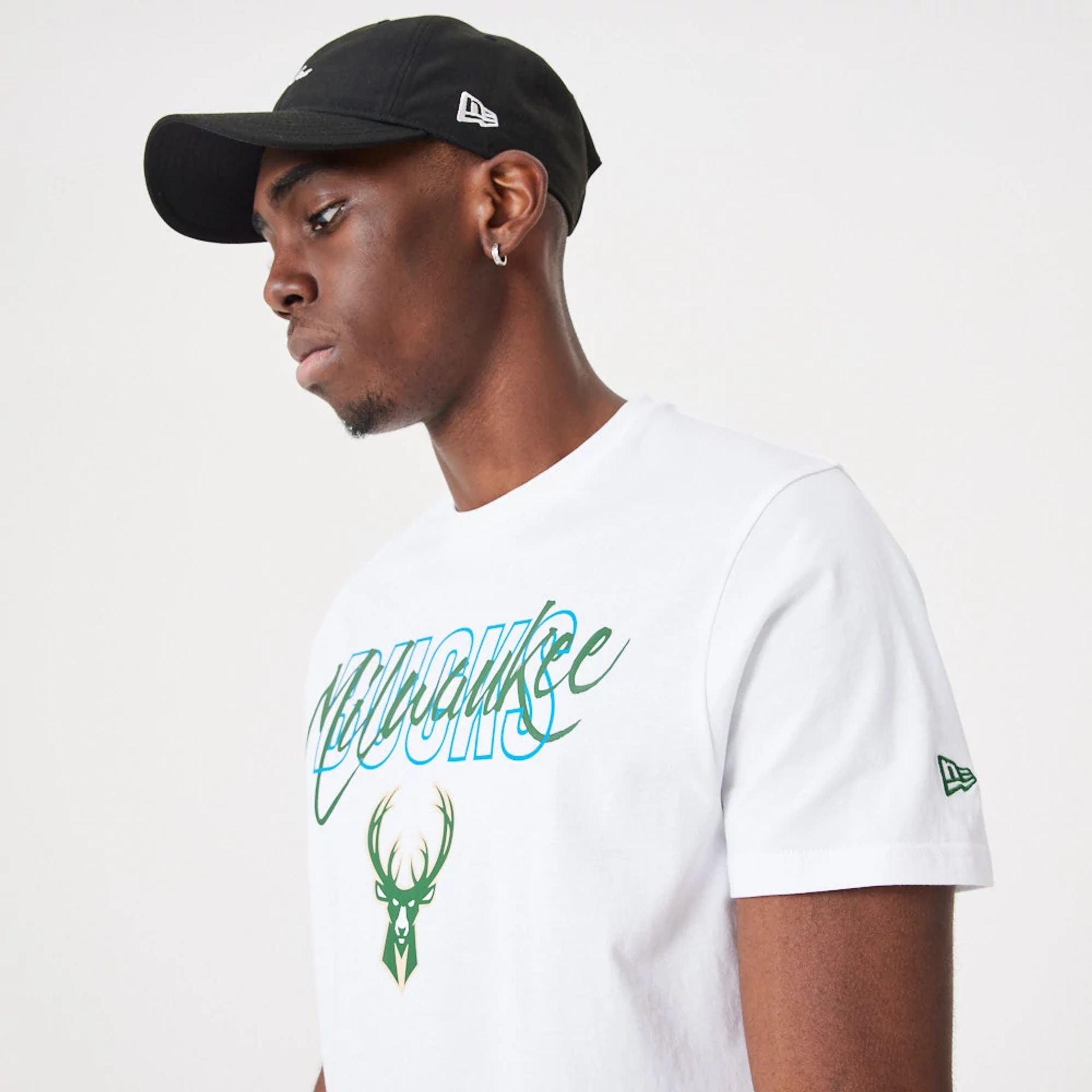 The Male model is wearing Milwaukee Bucks NBA Script White T-Shirt 4