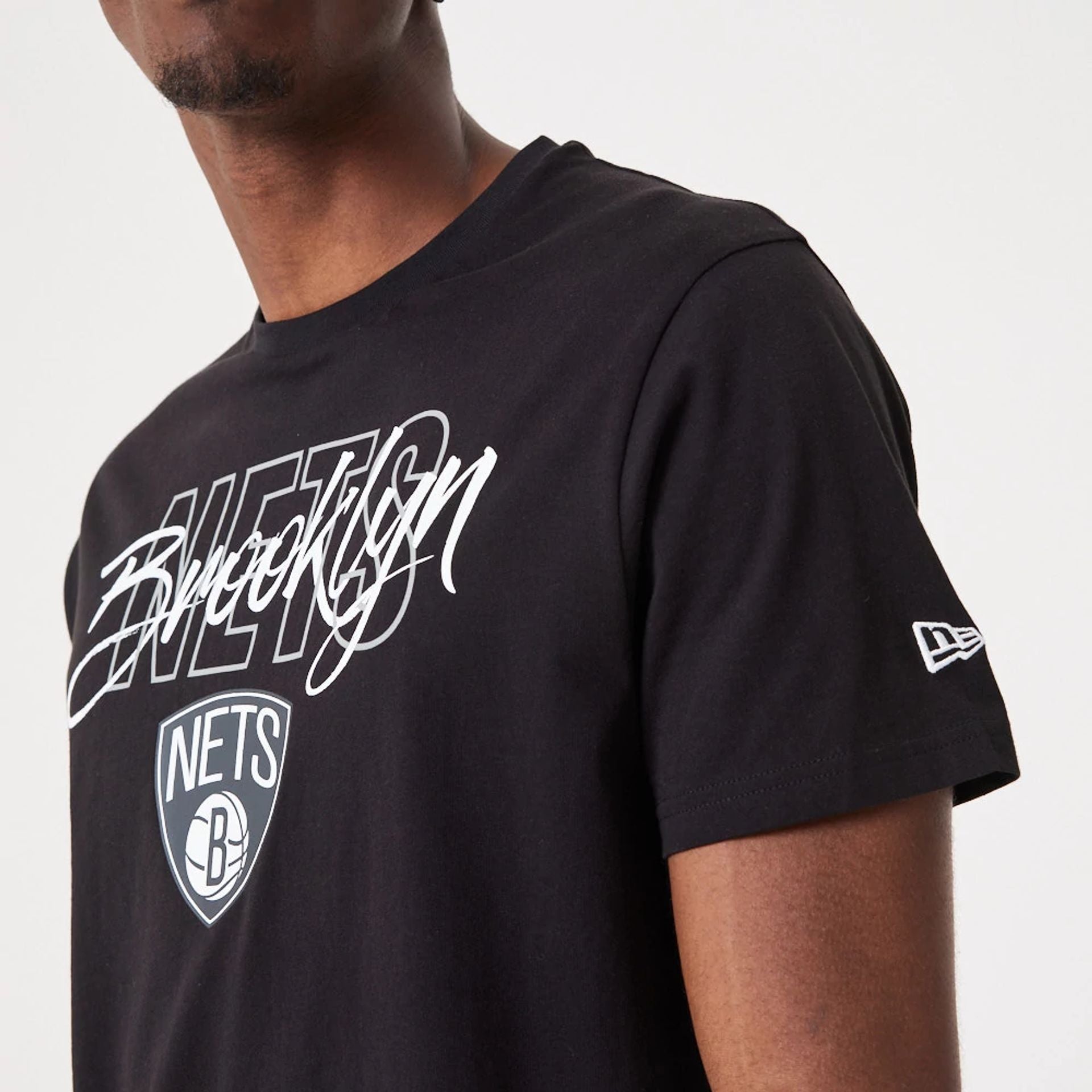 The Male model is wearing Brooklyn Nets NBA Script Black T-Shirt 3