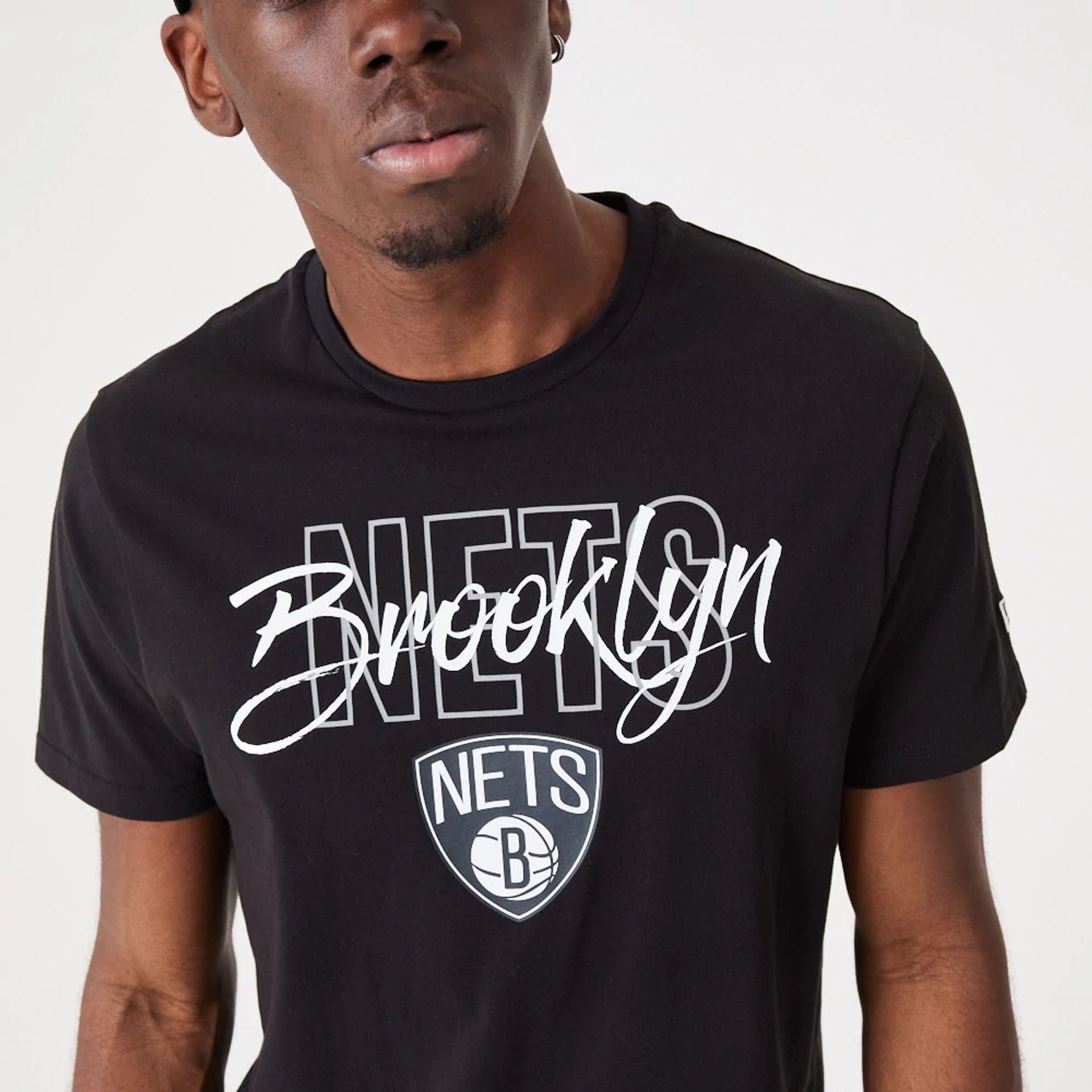 The Male model is wearing Brooklyn Nets NBA Script Black T-Shirt 4