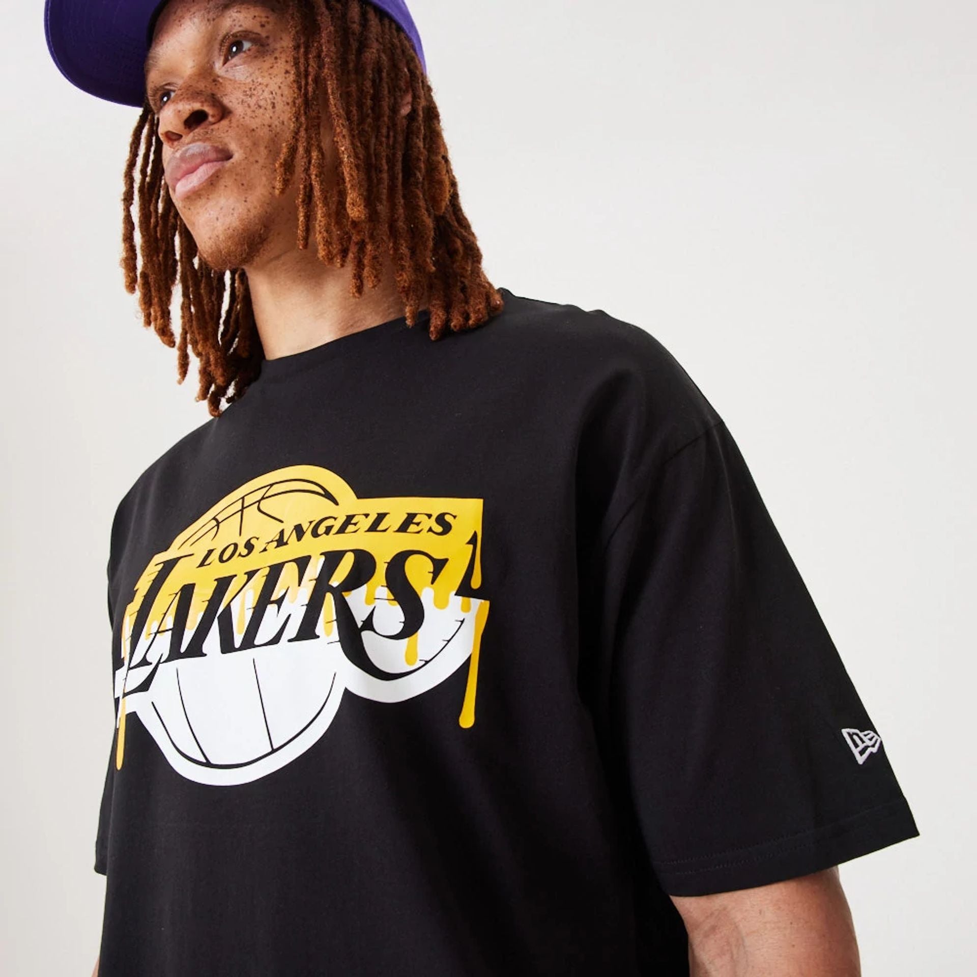 The Male model is wearing LA Lakers NBA Drip Logo Black T-Shirt 4