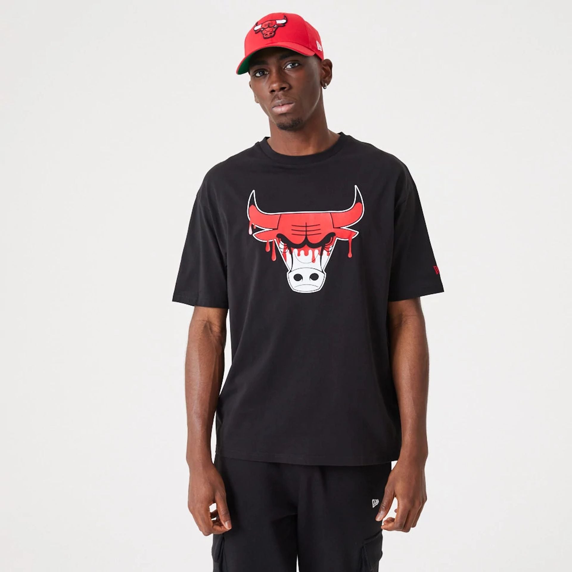 The Male model is wearing Chicago NBA Drip Logo Bulls Black T-Shirt 1