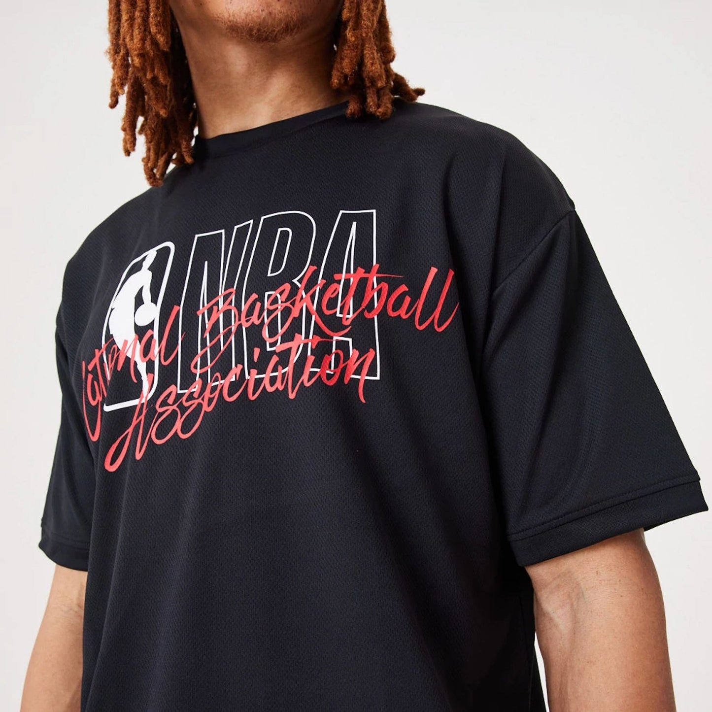 The Male model is wearing NBA Logo Script Black Oversized T-Shirt 2