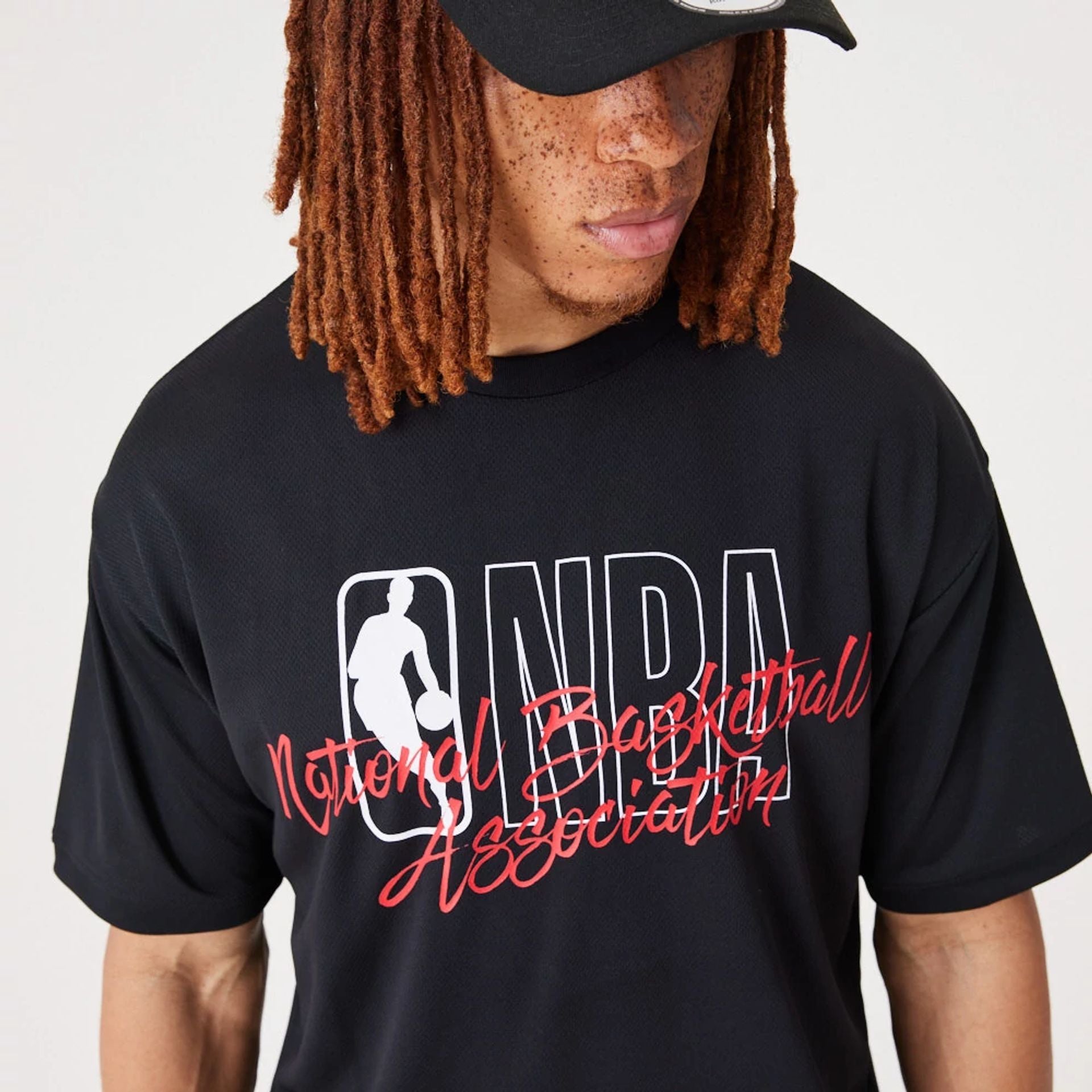 The Male model is wearing NBA Logo Script Black Oversized T-Shirt 1