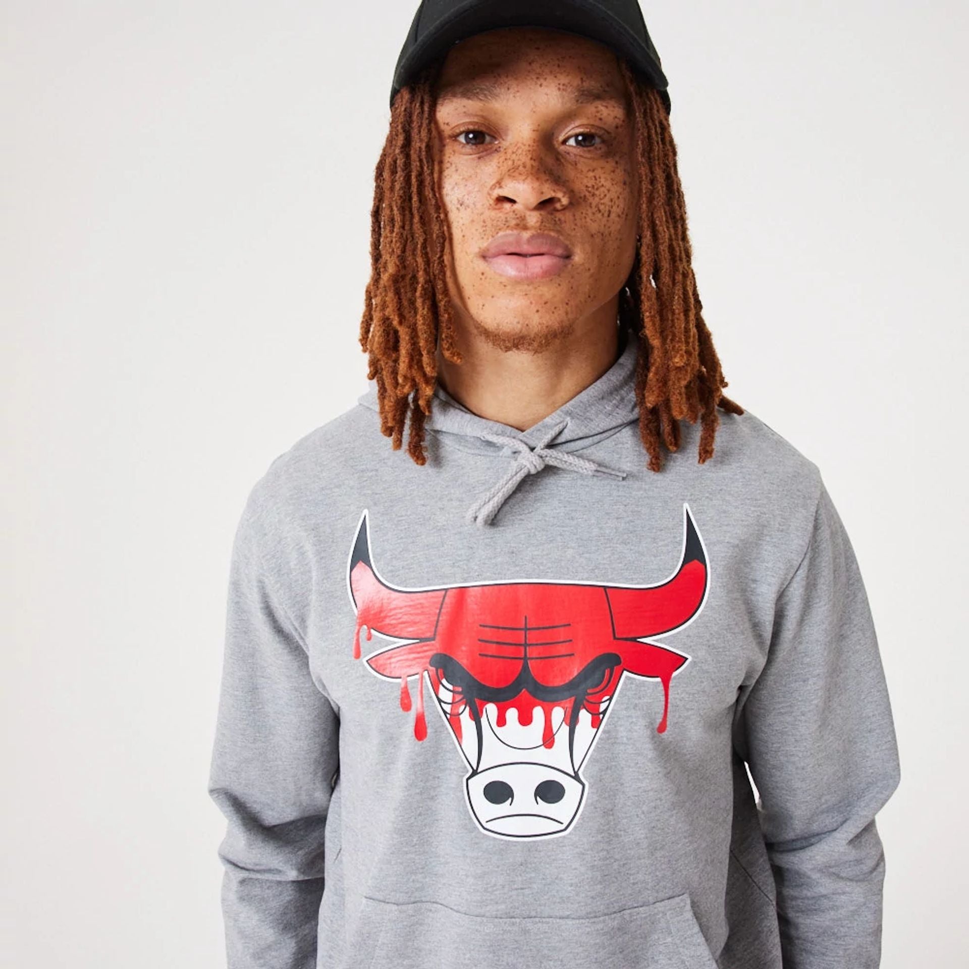 The Male model is wearing Chicago Bulls NBA Drip Logo Medium Grey Pullover Hoodie 3