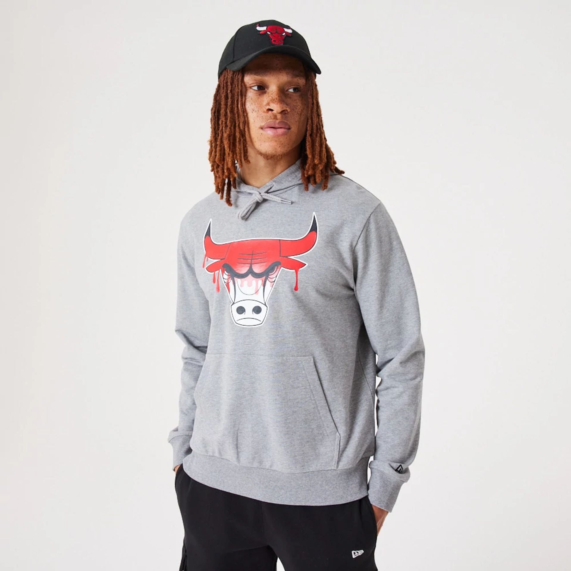 The Male model is wearing Chicago Bulls NBA Drip Logo Medium Grey Pullover Hoodie 1