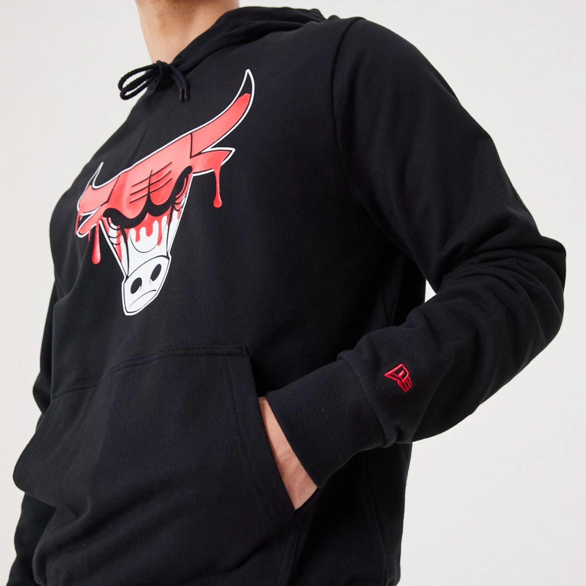 The Male model is wearing Chicago Bulls NBA Drip Logo Black Pullover Hoodie 4