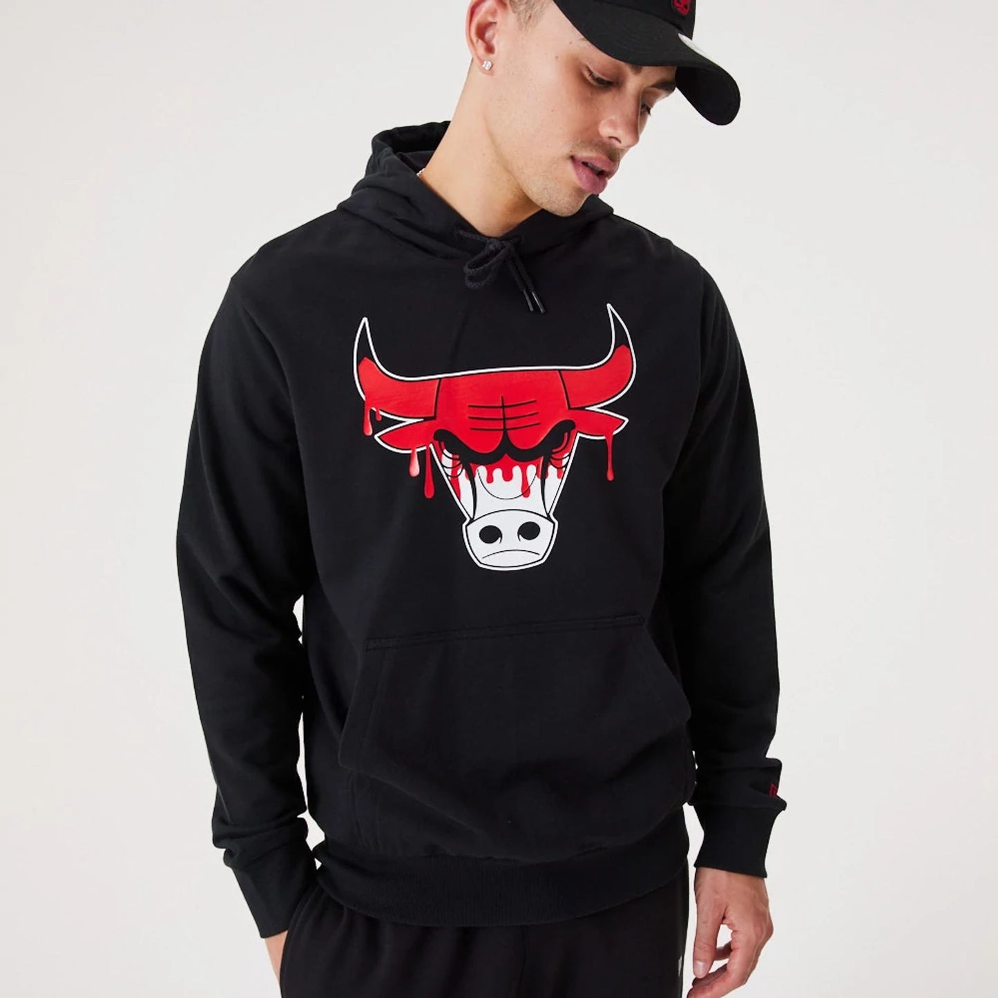 The Male model is wearing Chicago Bulls NBA Drip Logo Black Pullover Hoodie 5