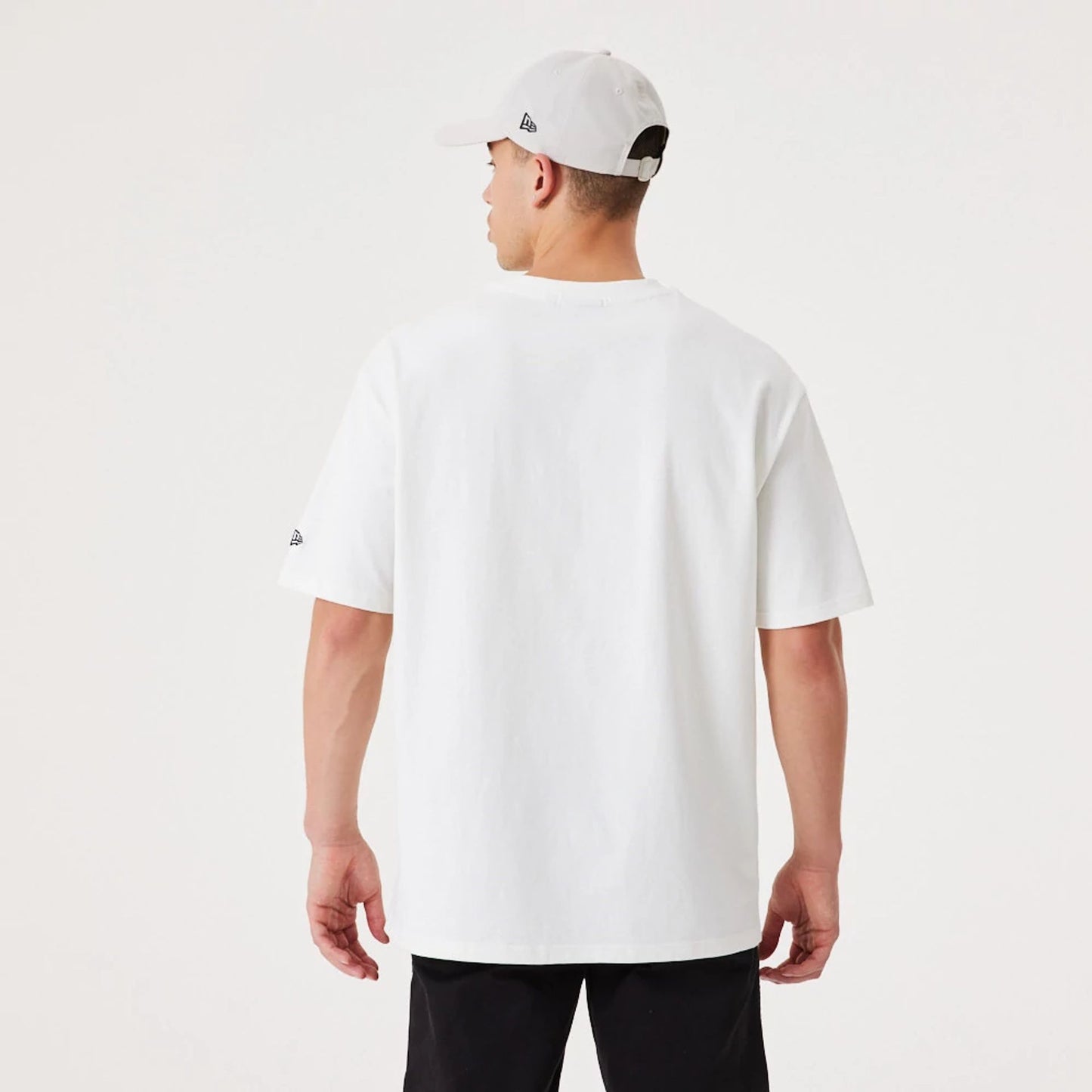 The Male model is wearing New Era Contemporary White Oversized T-Shirt 2