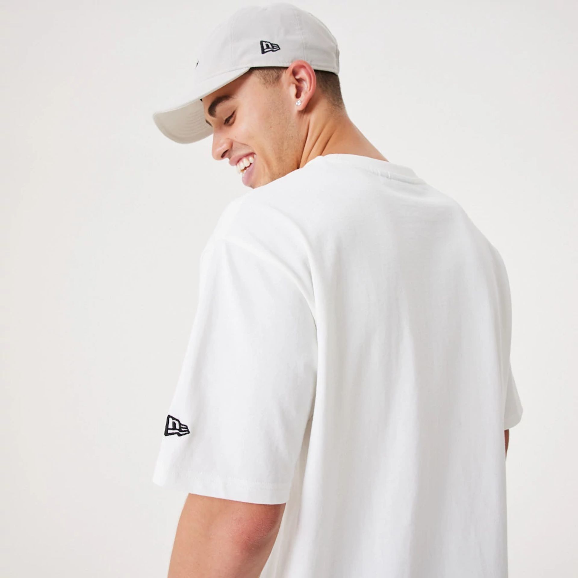 The Male model is wearing New Era Contemporary White Oversized T-Shirt 4