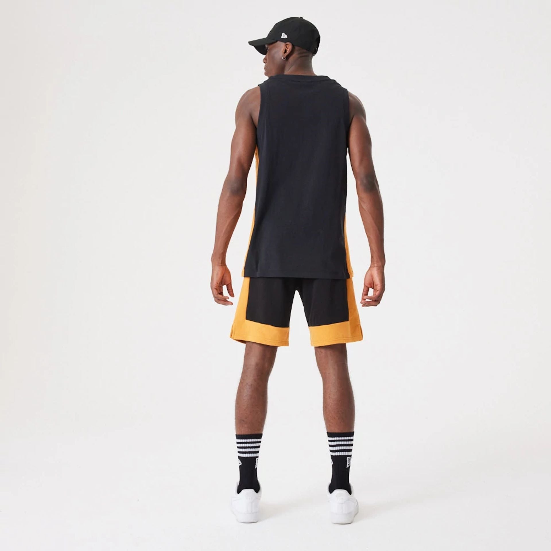 The Male model is wearing New Era Contemporary Black Oversized Shorts 7