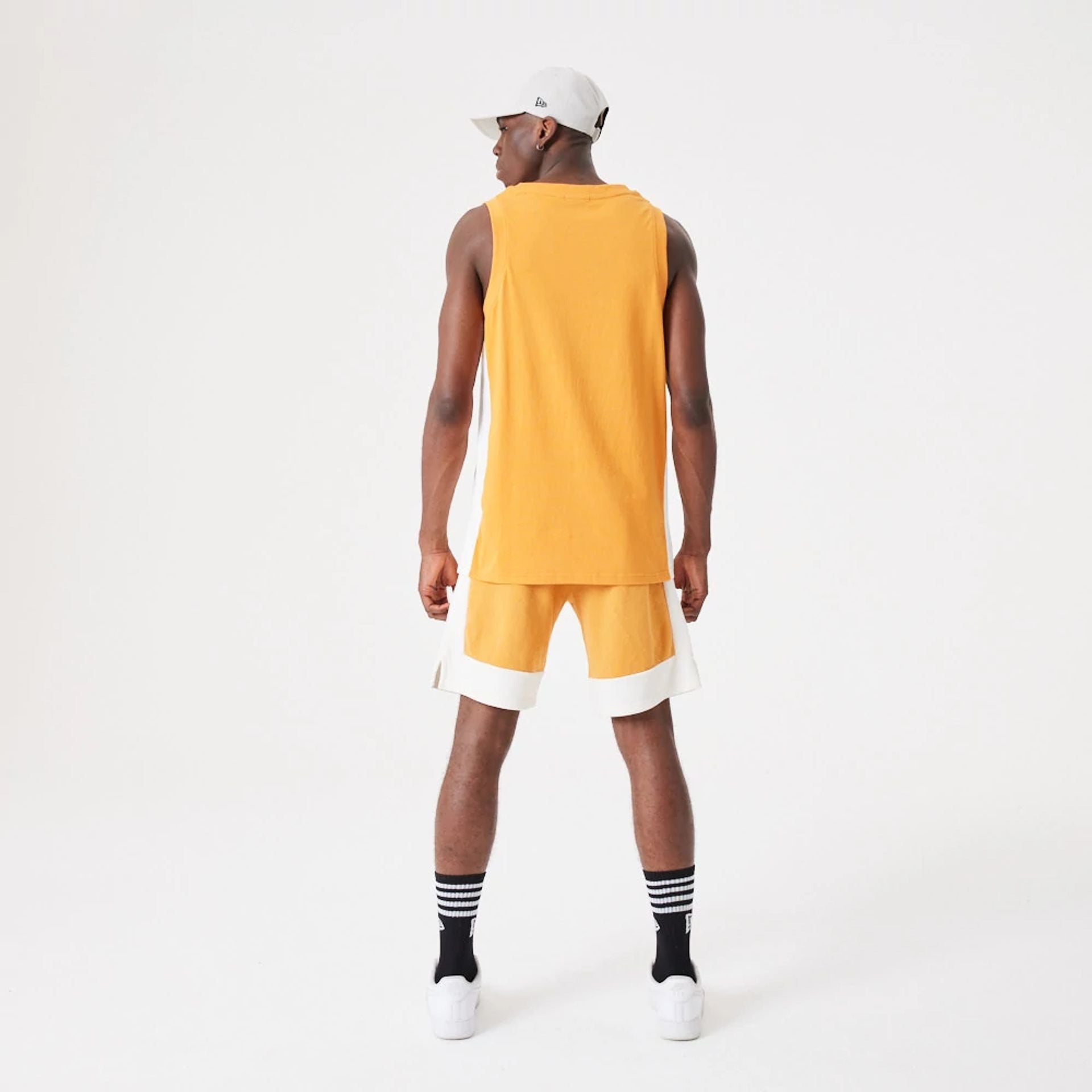 The Male model is wearing New Era Contemporary Medium Orange Oversized Shorts 7