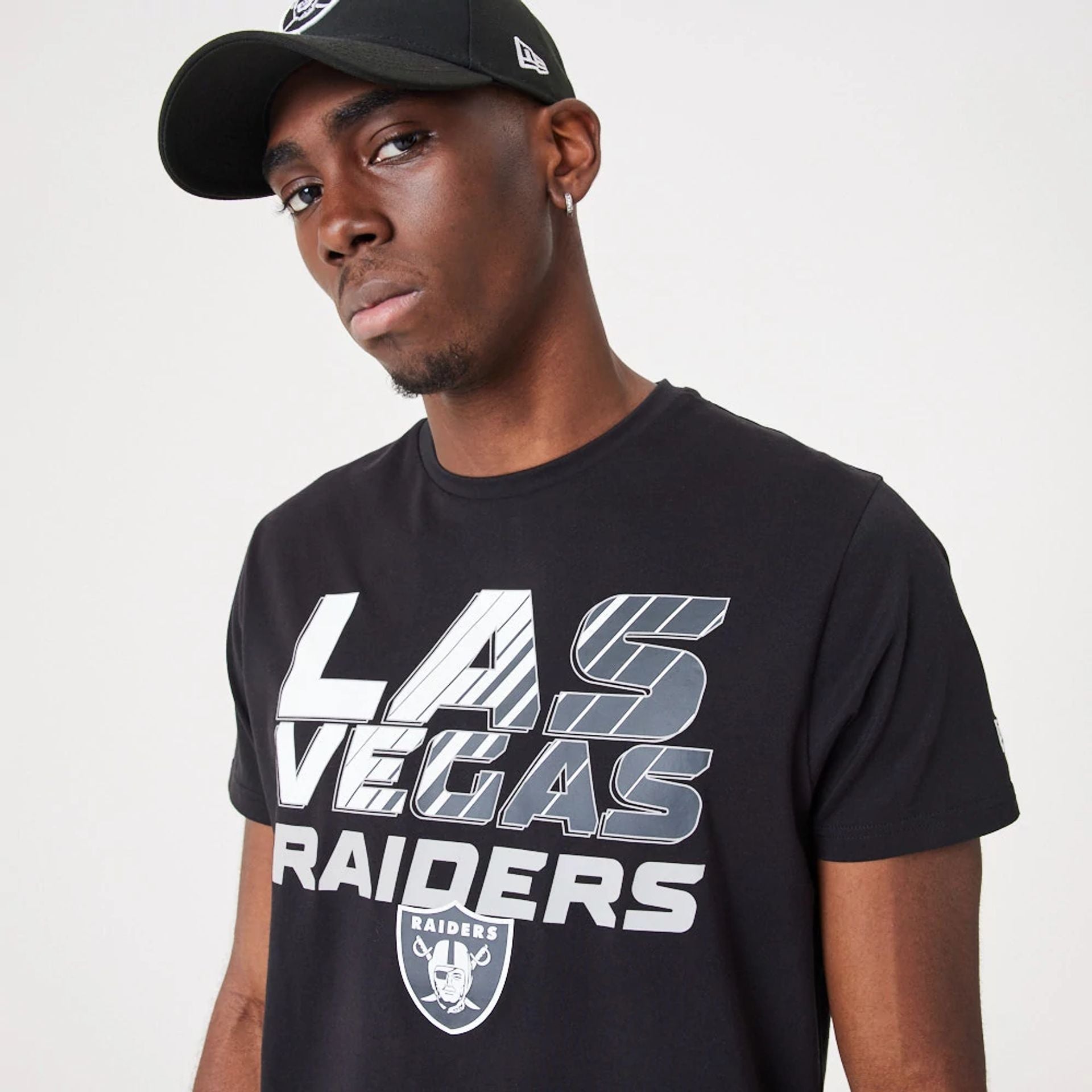 The Male model is wearing Las Vegas Raiders NFL Gradient Wordmark Black T-Shirt 2