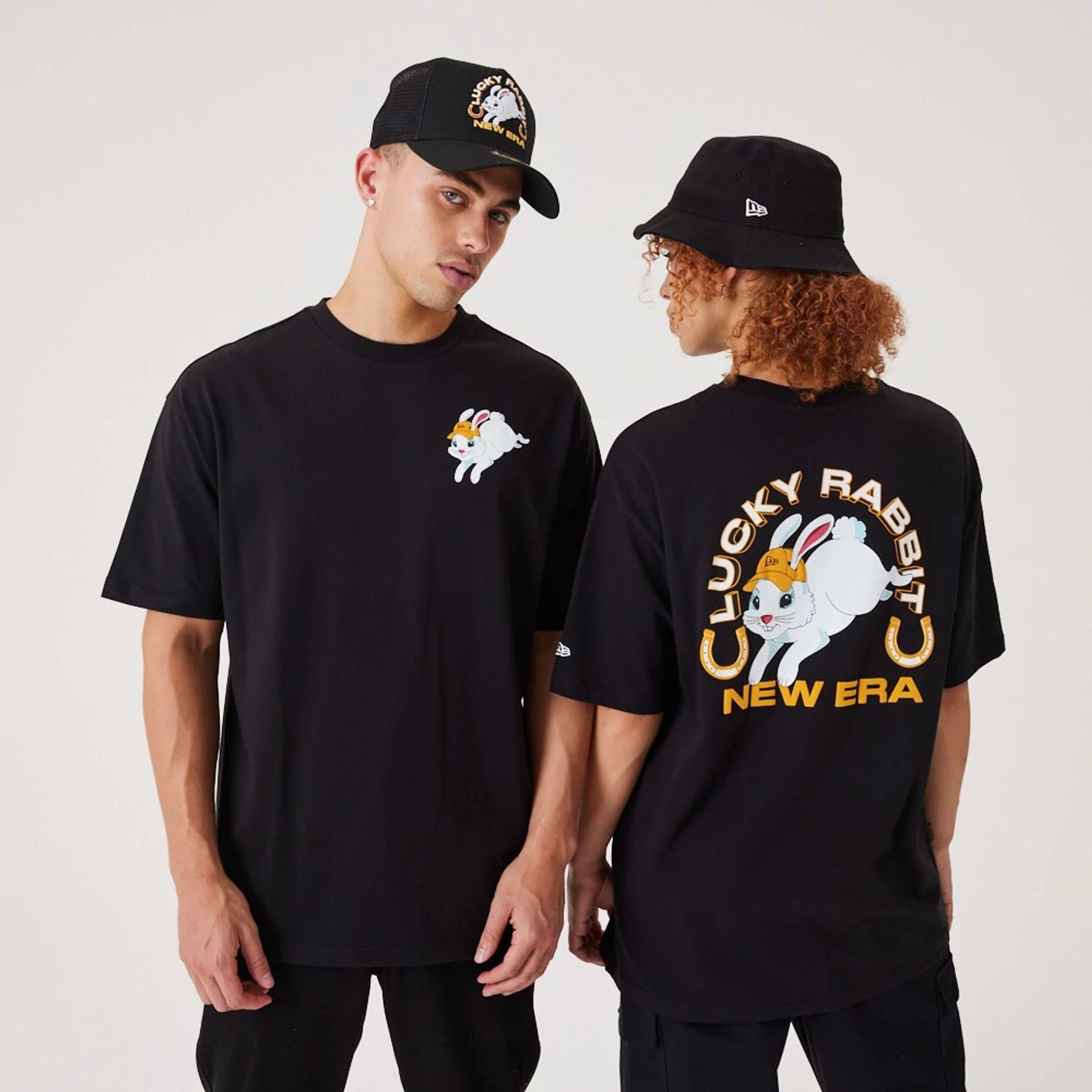 The Male model is wearing New Era Lucky Rabbit Black Oversized T-Shirt 1