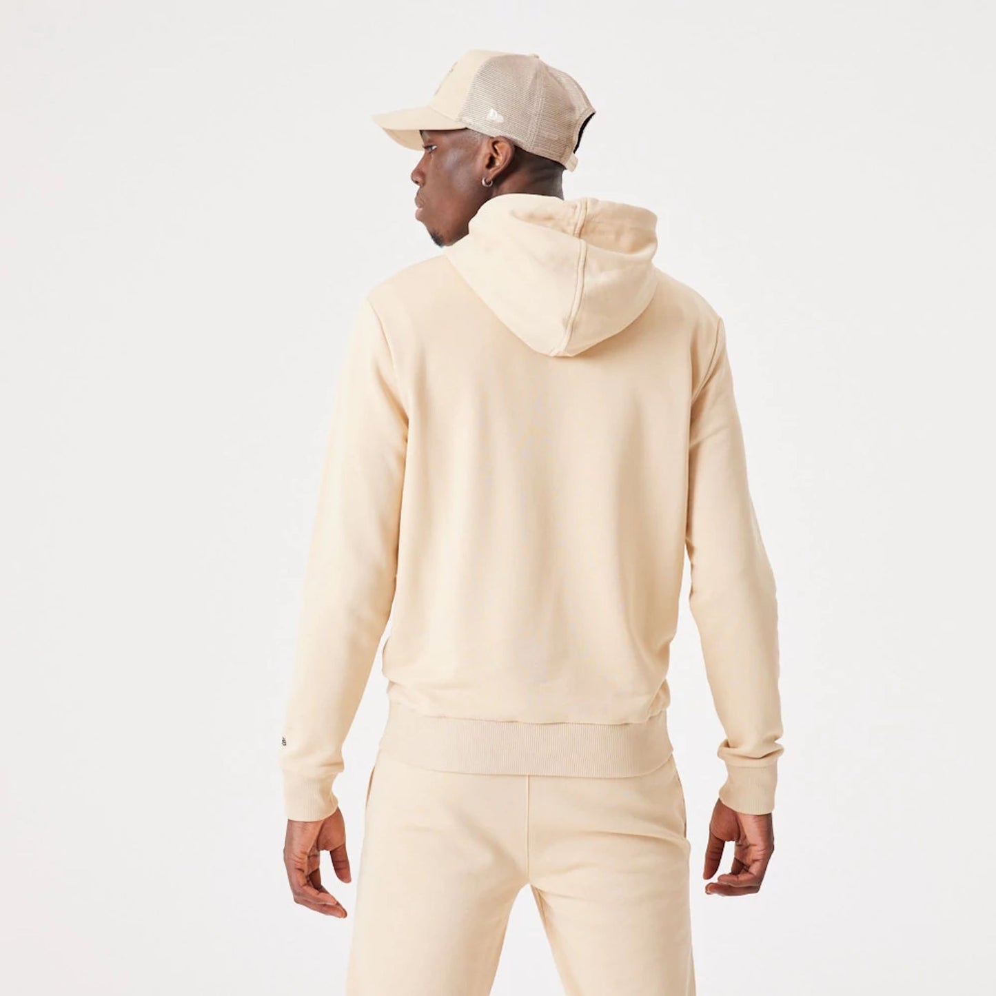 The Male model is wearing New Era Essential Light Beige Pullover Hoodie 8