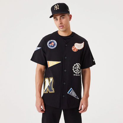 The Male model is wearing New Era Heritage Badge Black Jersey 1