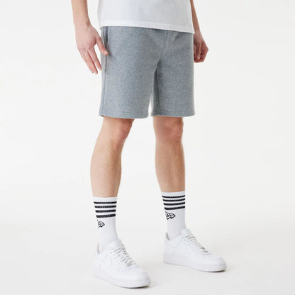 The Male model is wearing New Era Grey Essential Shorts 4