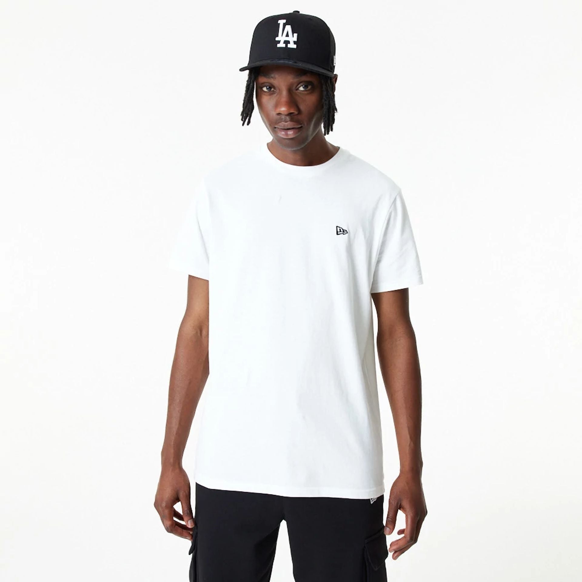 The Male model is wearing New Era Essential Plain White T-Shirt 1