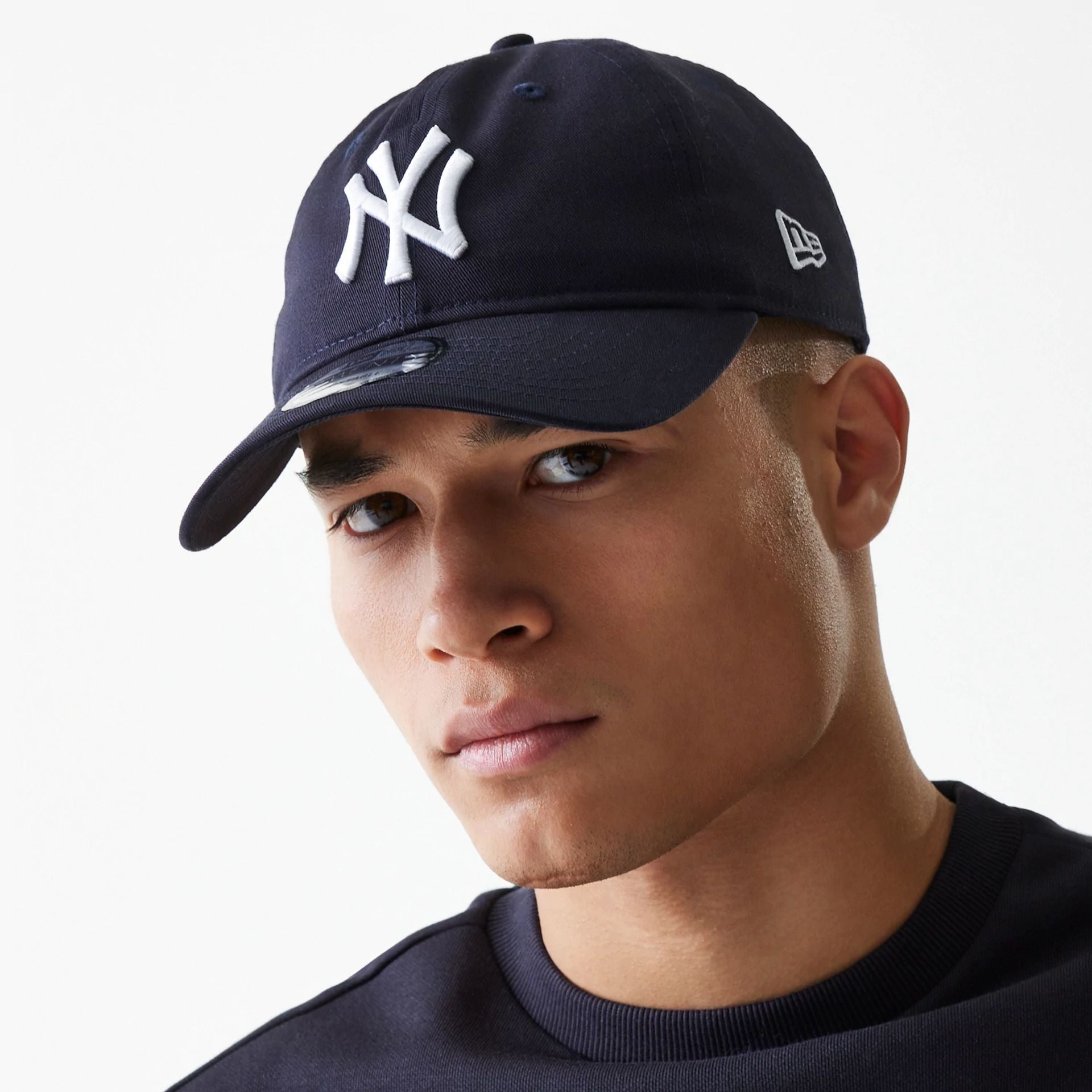 This is a New York Yankees League Essential Navy 9TWENTY Adjustable Cap 1