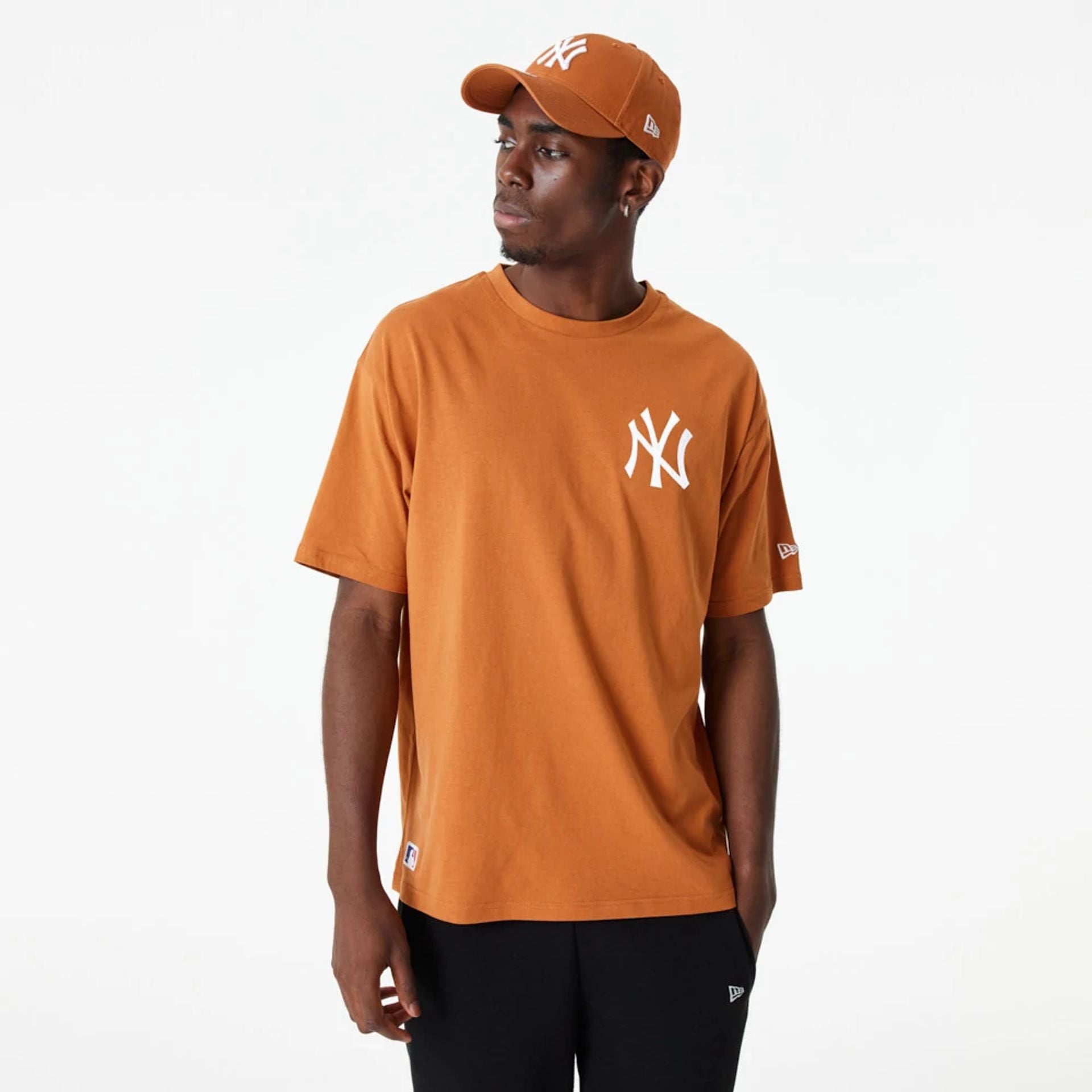 The Male model is wearing New York Yankees League Essential Orange Oversized T-Shirt 2