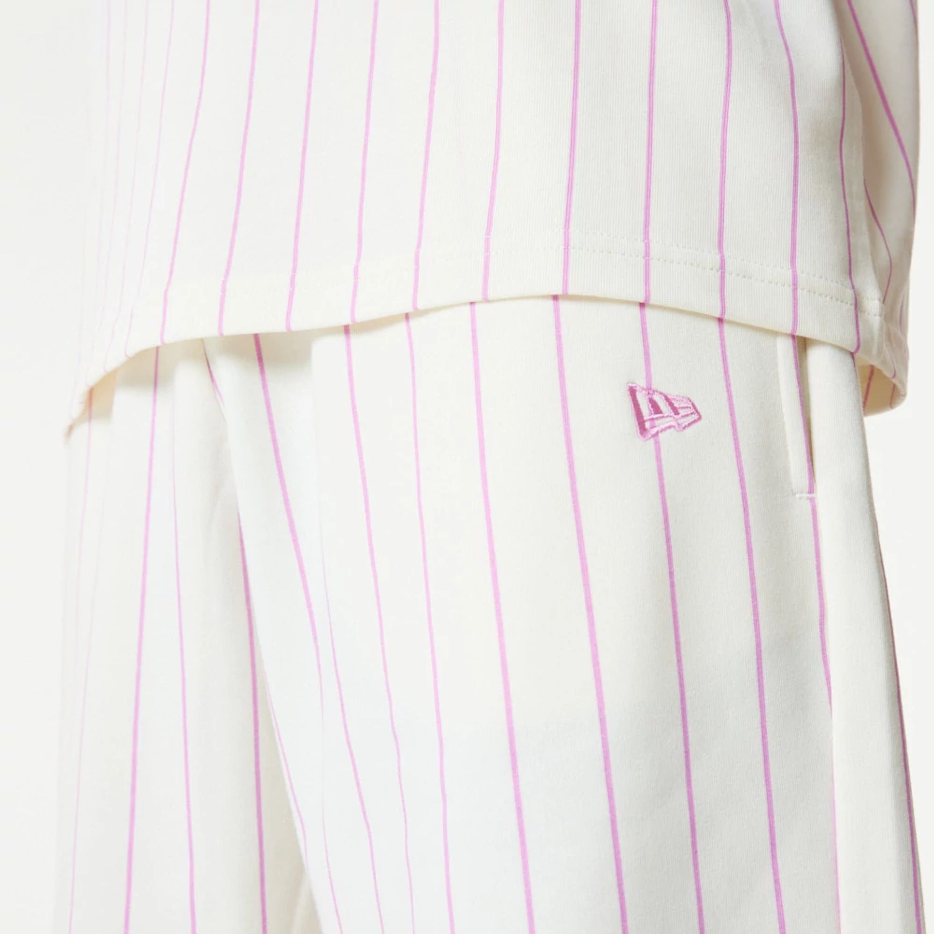 The Male model is wearing New Era Pink Pinstripe White Shorts 2