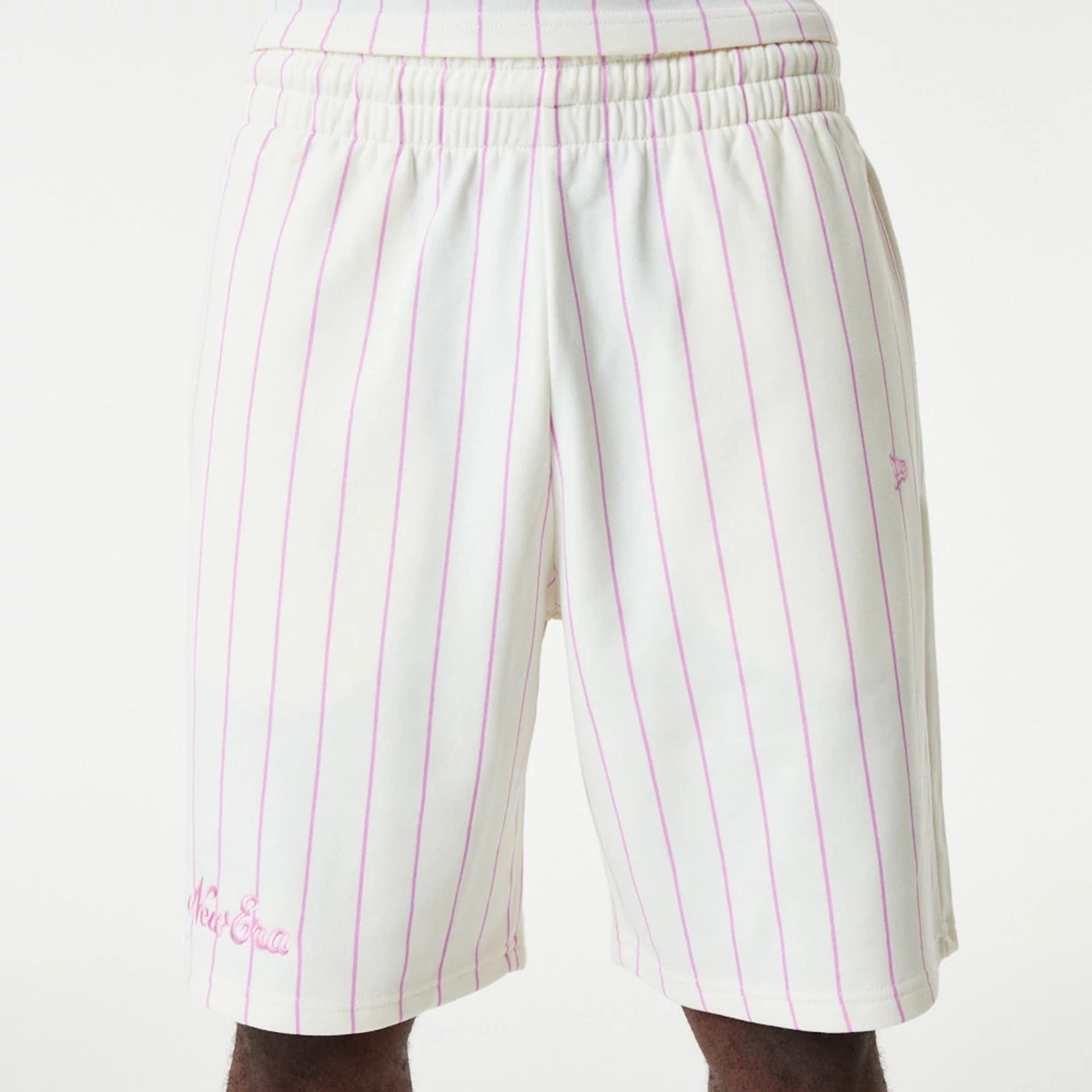 The Male model is wearing New Era Pink Pinstripe White Shorts 3