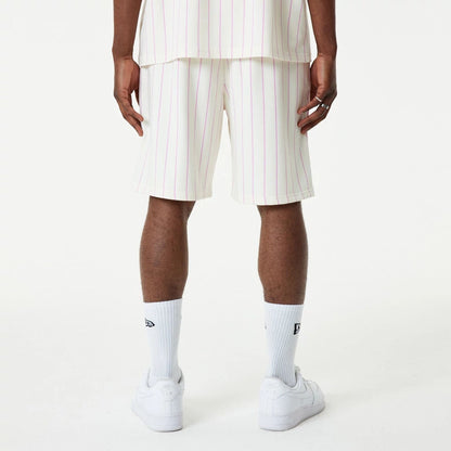 The Male model is wearing New Era Pink Pinstripe White Shorts 4