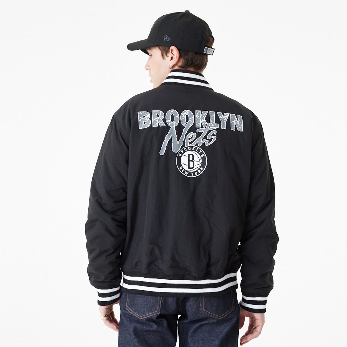 The Male model is wearing Brooklyn Nets Team Script Black Bomber Jacket 2