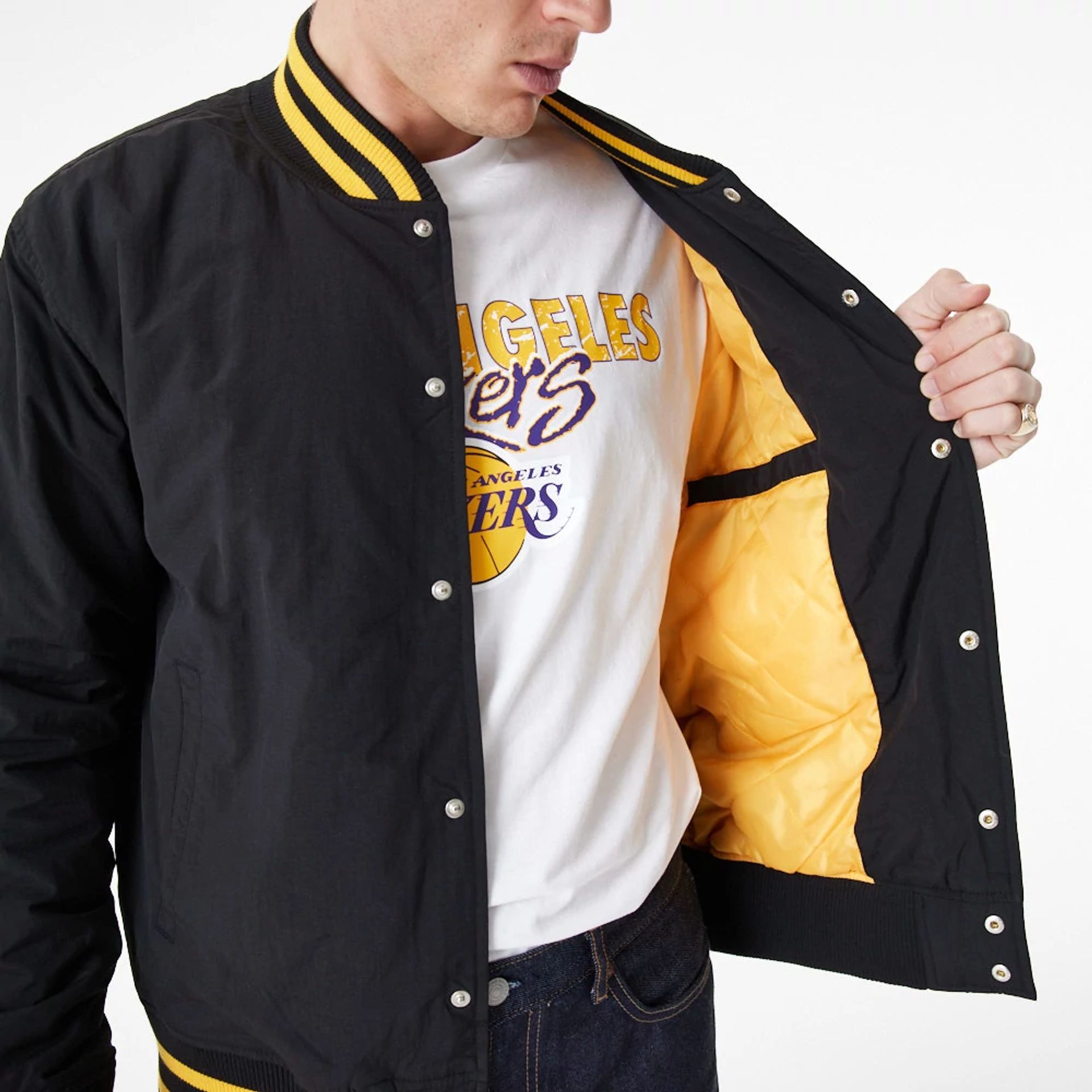 The Male model is wearing LA Lakers Team Script Black Bomber Jacket 2