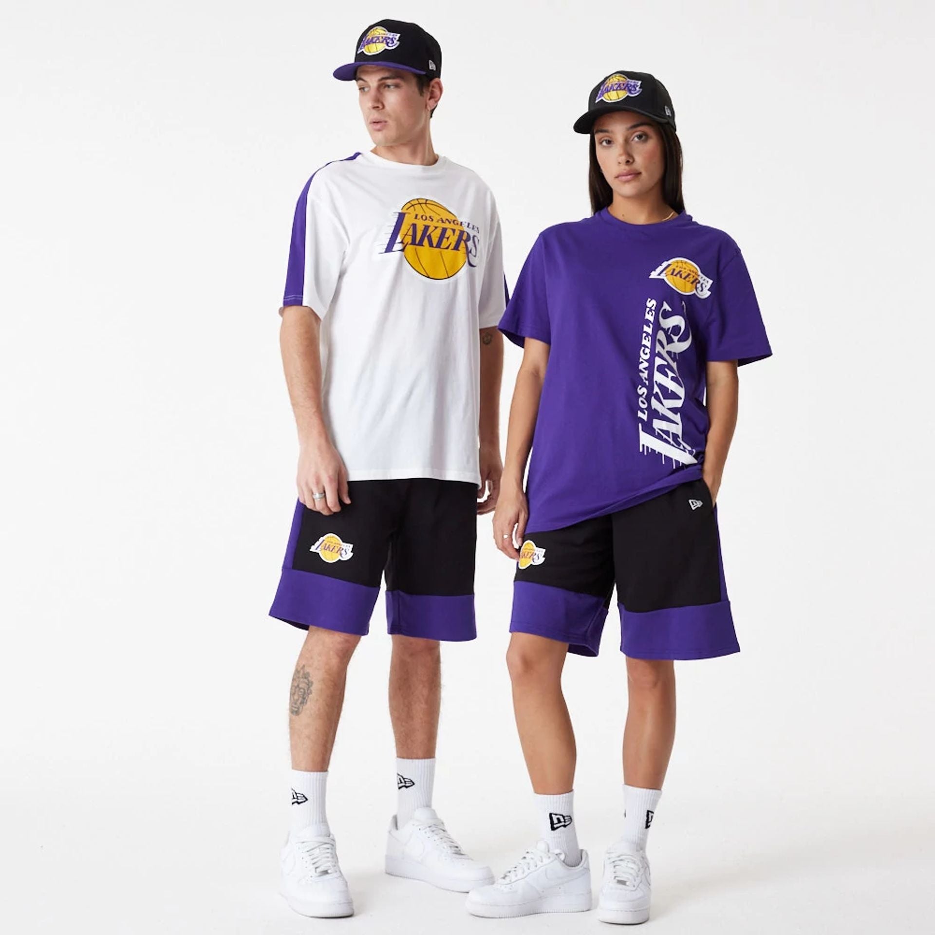 The Male model is wearing LA Lakers NBA Colour Block Black Shorts 3