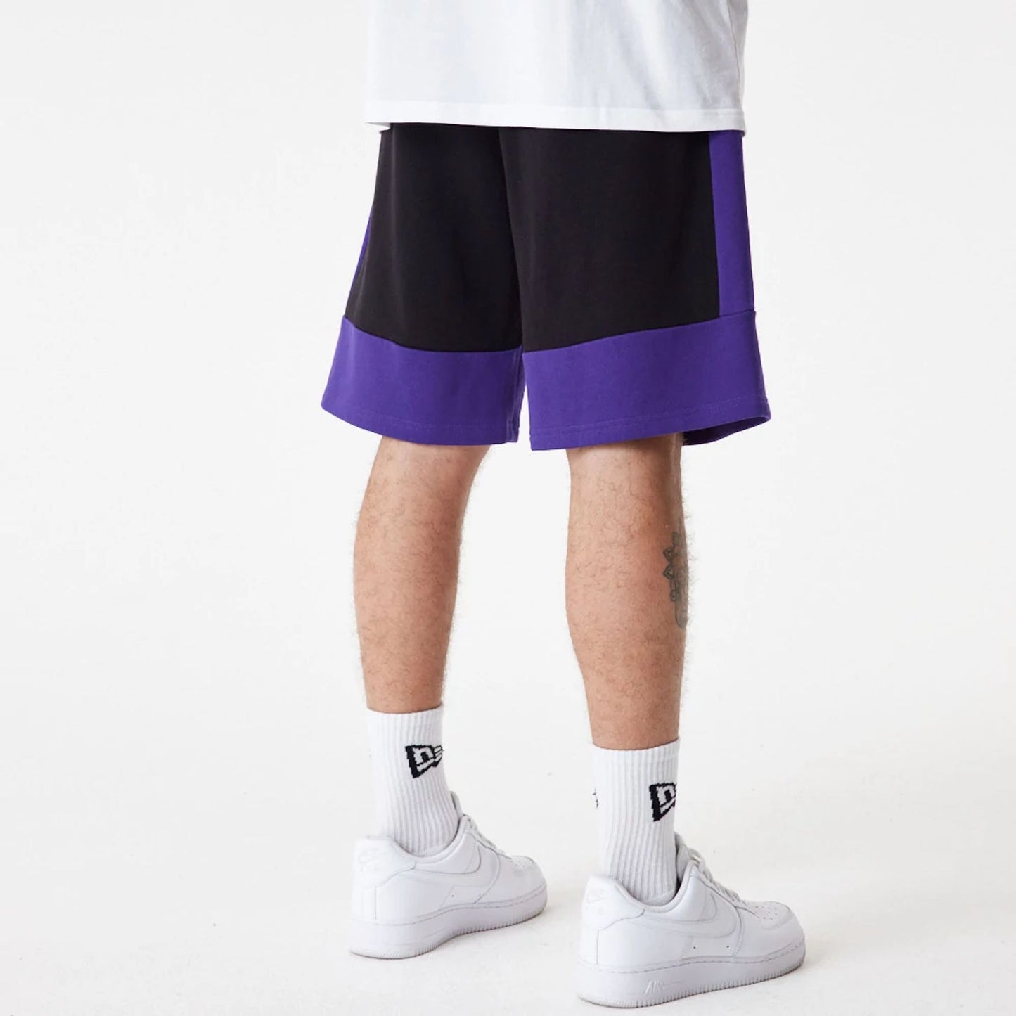 The Male model is wearing LA Lakers NBA Colour Block Black Shorts 4