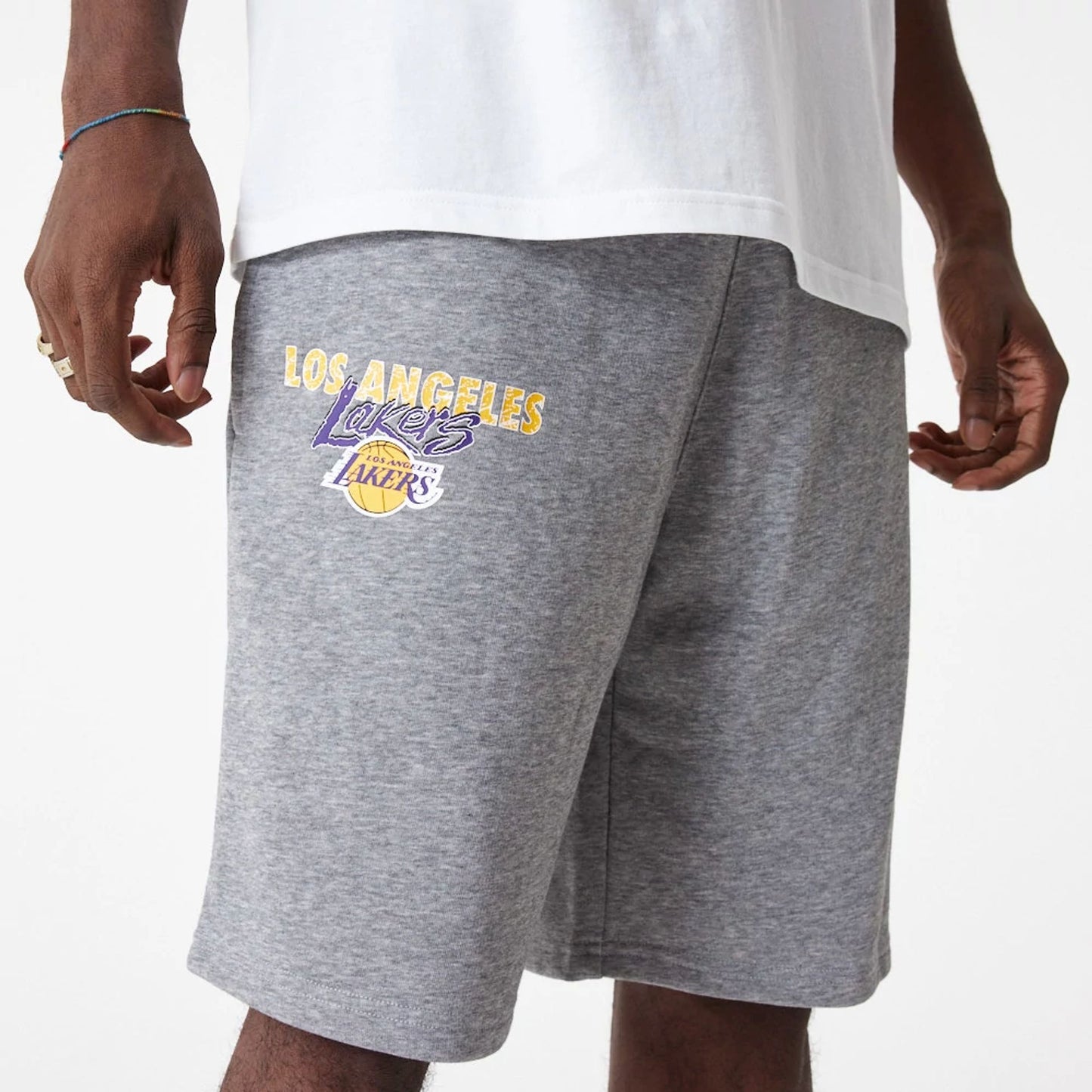 The Male model is wearing LA Lakers Team Script Grey Shorts 5