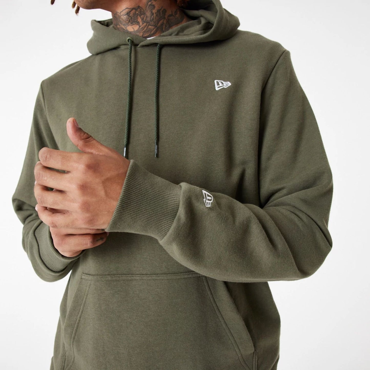 The Male model is wearing New Era Essential Green Pullover Hoodie 3