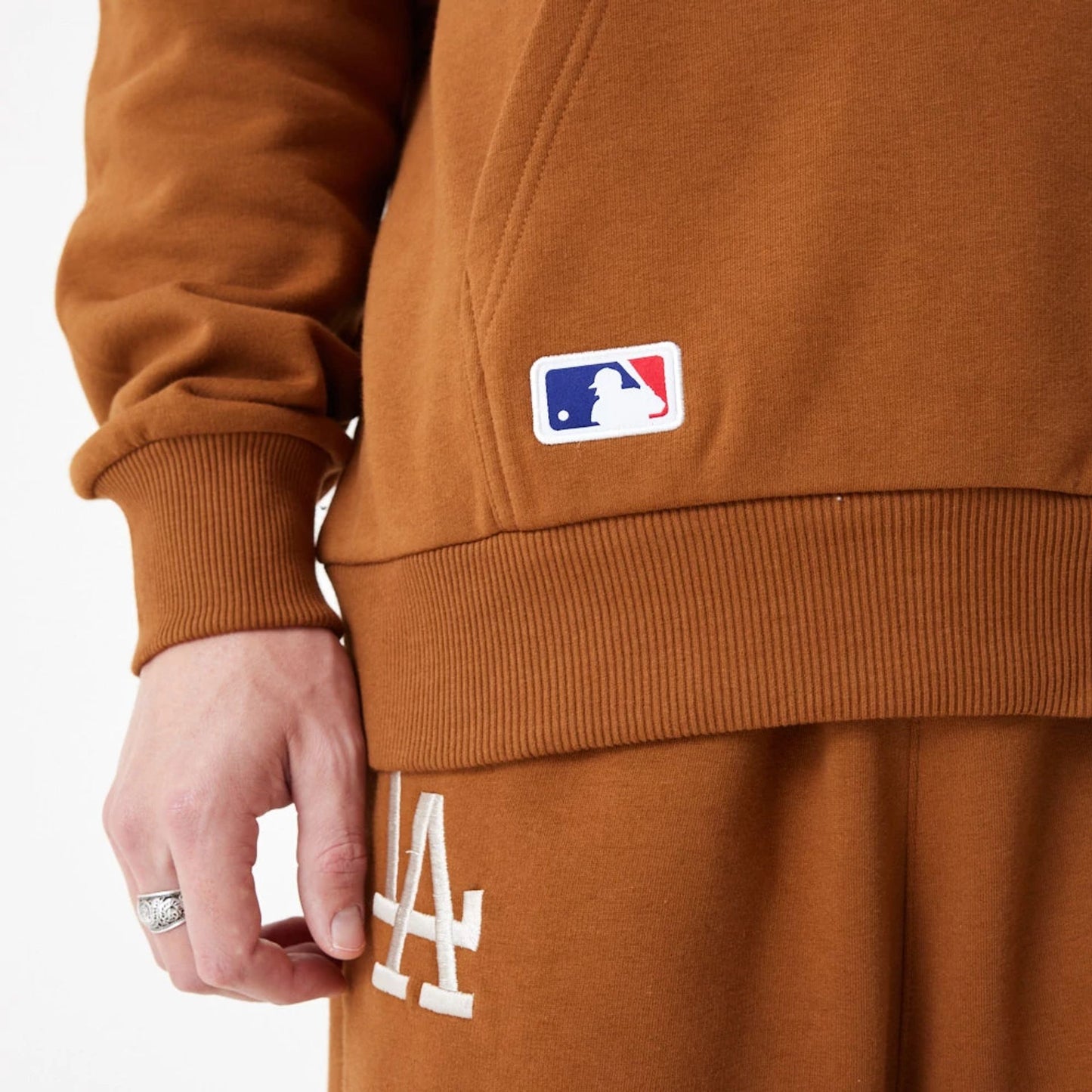 The Male model is wearing LA Dodgers League Essential Oversized Brown Hoodie 6