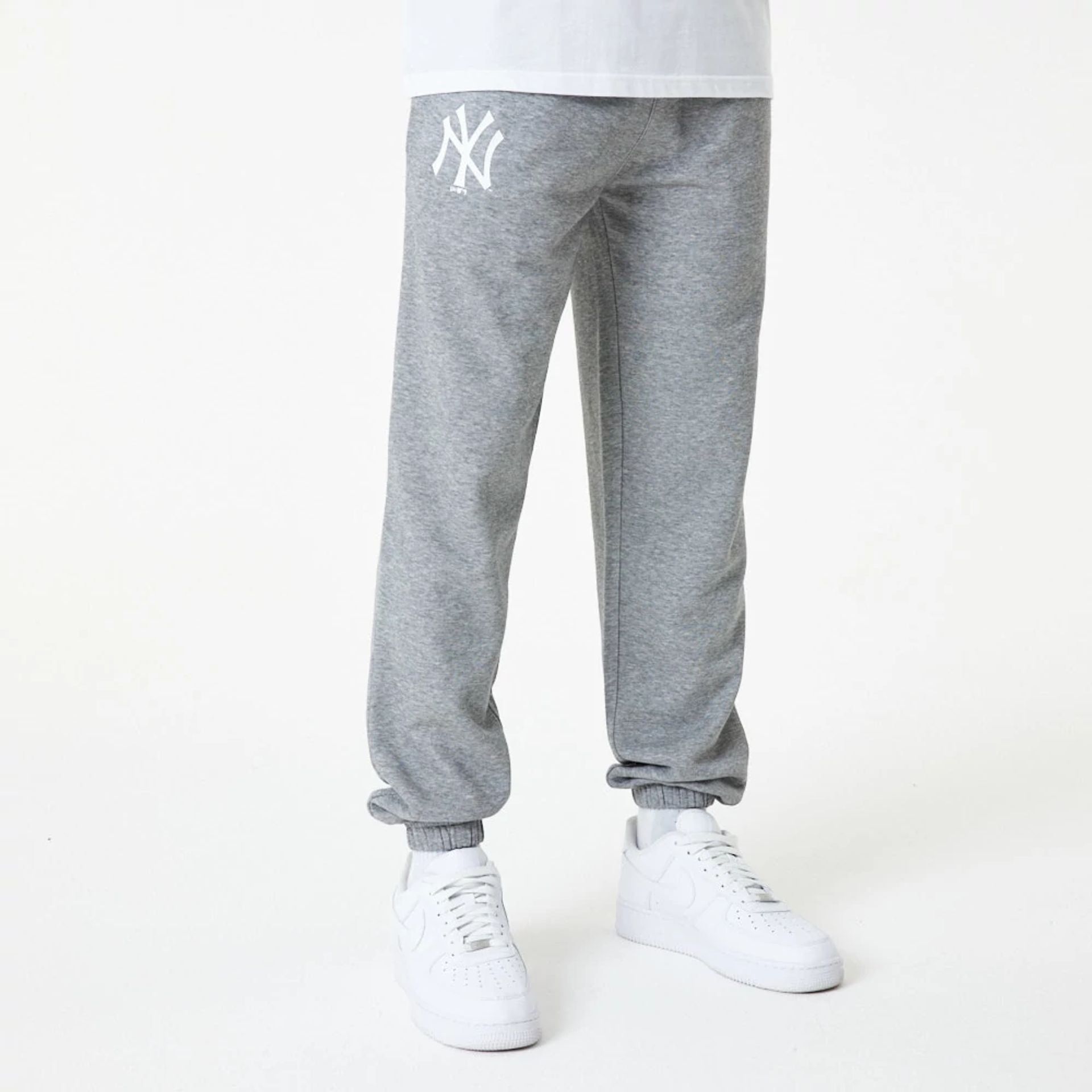 The Male model is wearing New York Yankees MLB Essential Grey Joggers 1