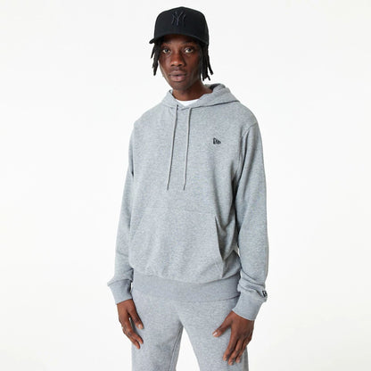 The Male model is wearing New Era Essential Grey Pullover Hoodie 2