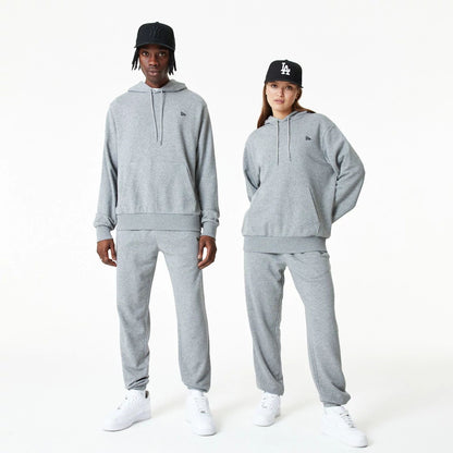 The Male model is wearing New Era Essential Grey Pullover Hoodie 9