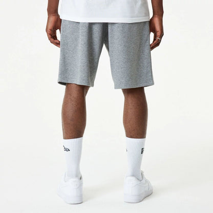 The Male model is wearing New Era Essential Grey Shorts 7