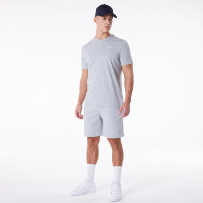 The Male model is wearing New Era Essential Grey Shorts 8