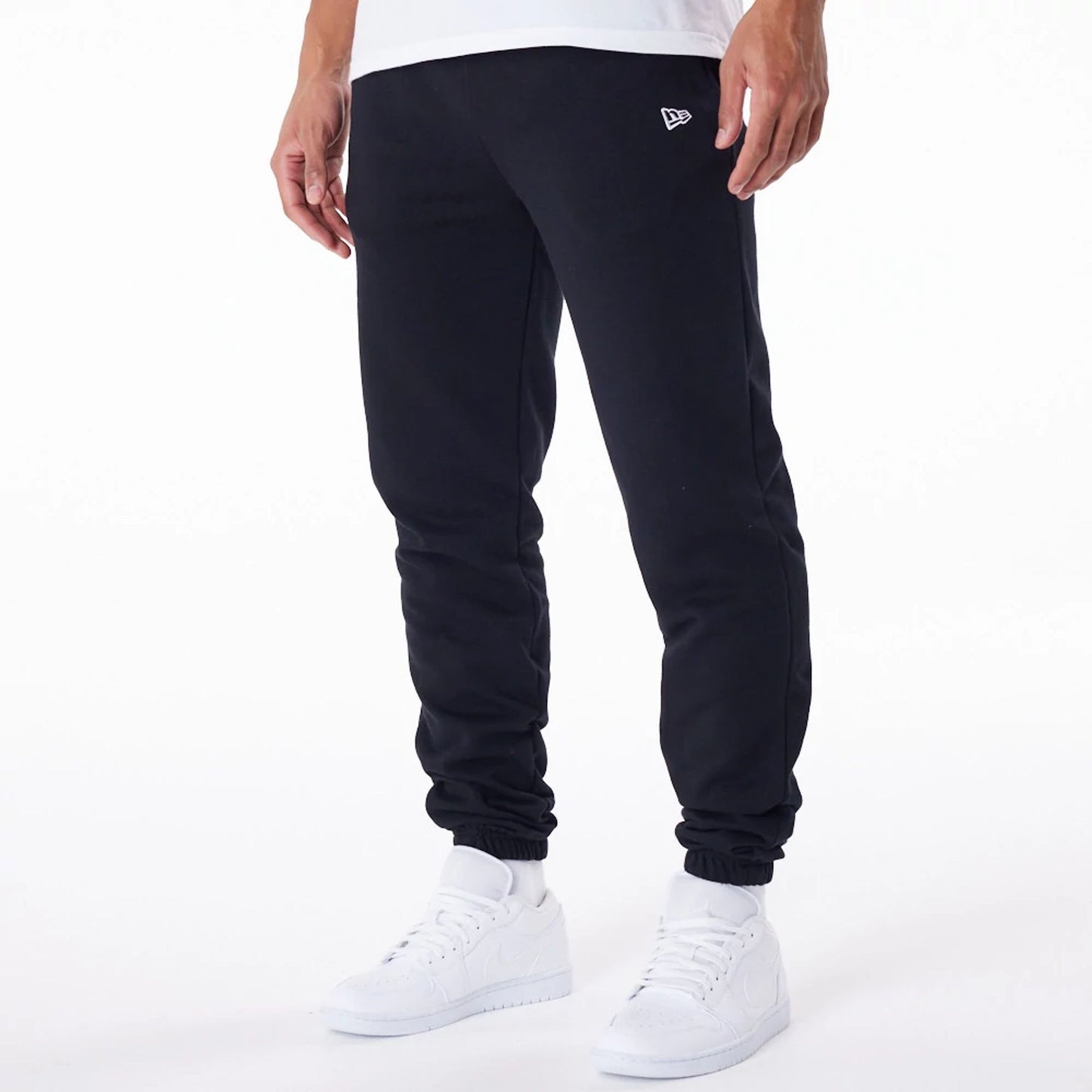 The Male model is wearing New Era Essential Black Joggers 6