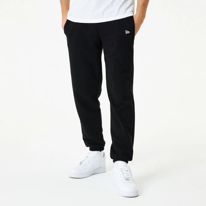 The Male model is wearing New Era Essential Black Joggers 1