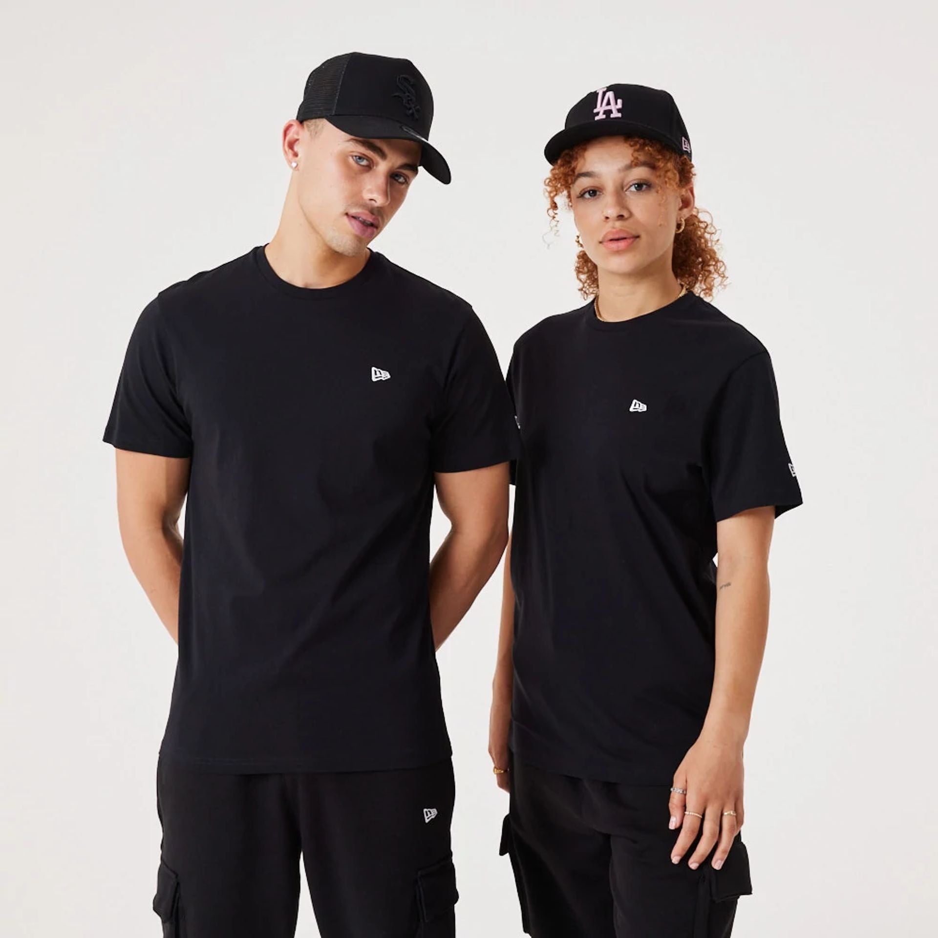 The Male model is wearing New Era Essential Black T-Shirt 1