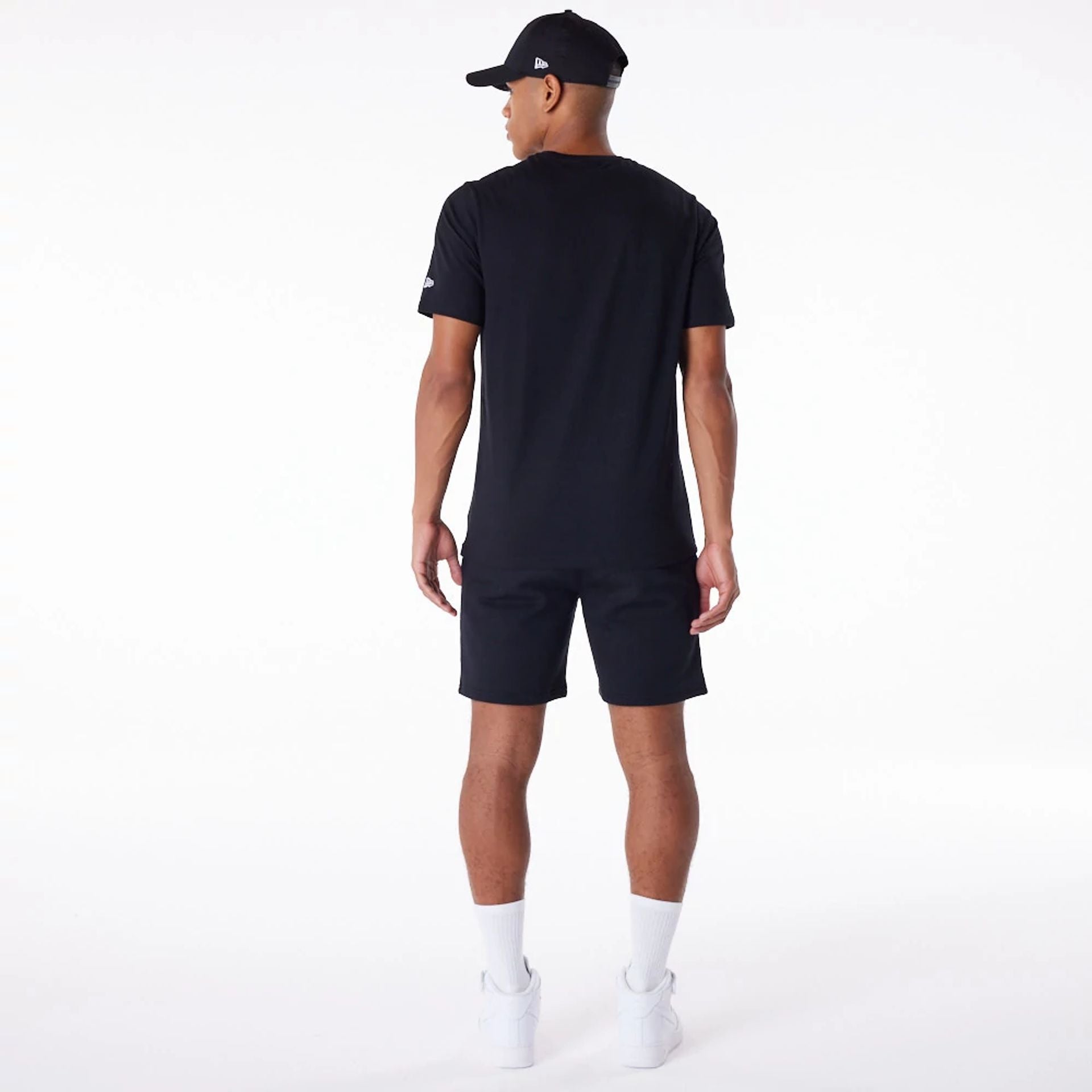 The Male model is wearing New Era Essential Black T-Shirt 9