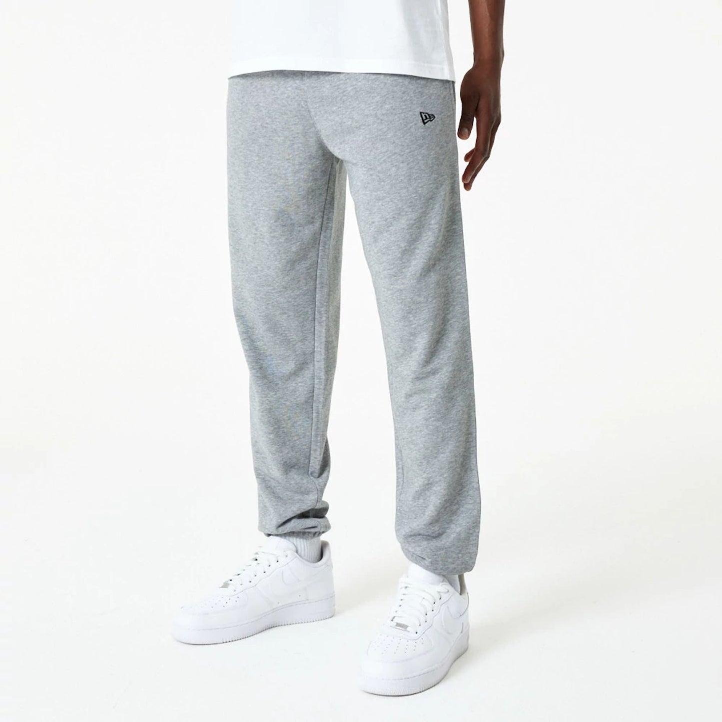 The Male model is wearing New Era Essential Grey Joggers 6