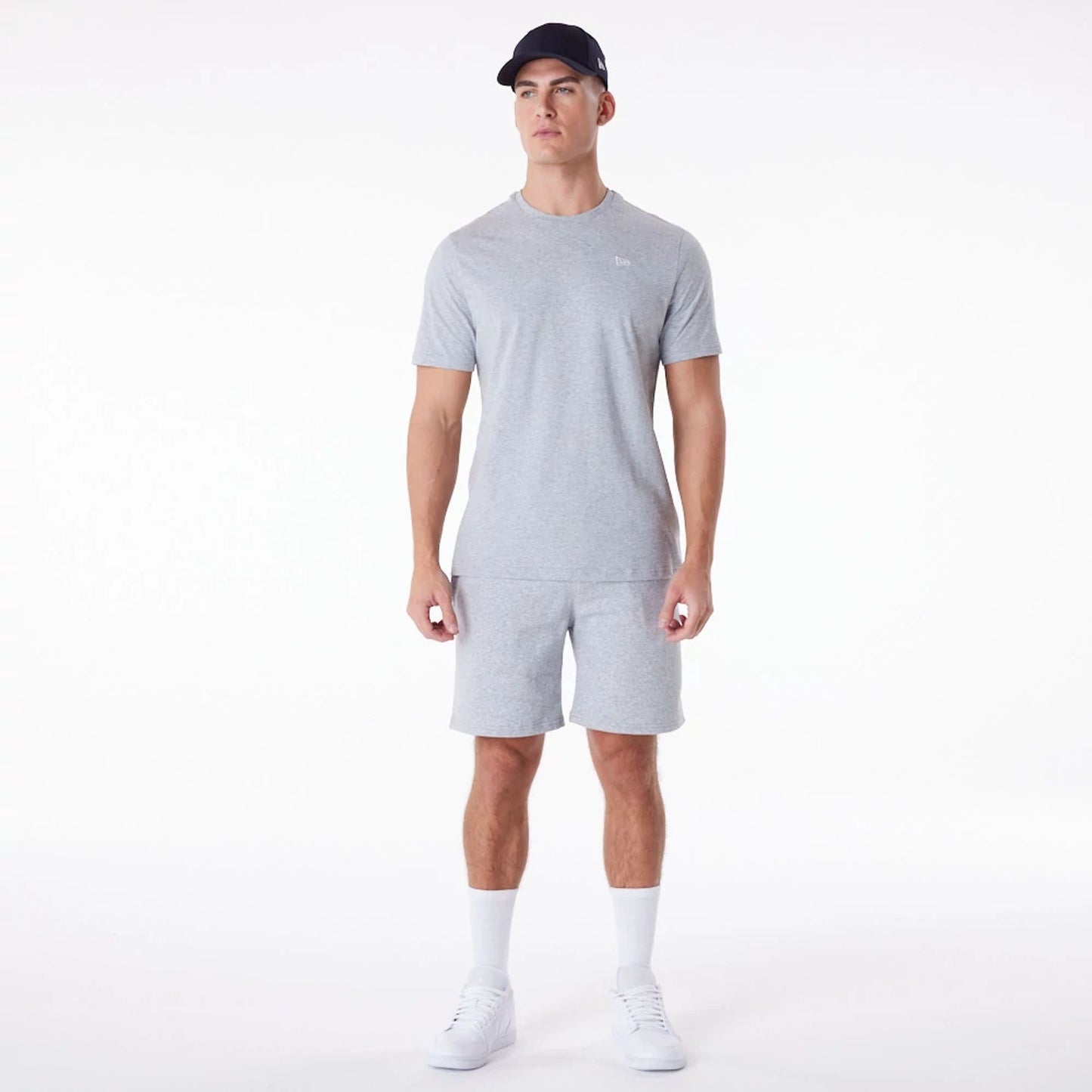 The Male model is wearing New Era Essential Grey T-Shirt 6