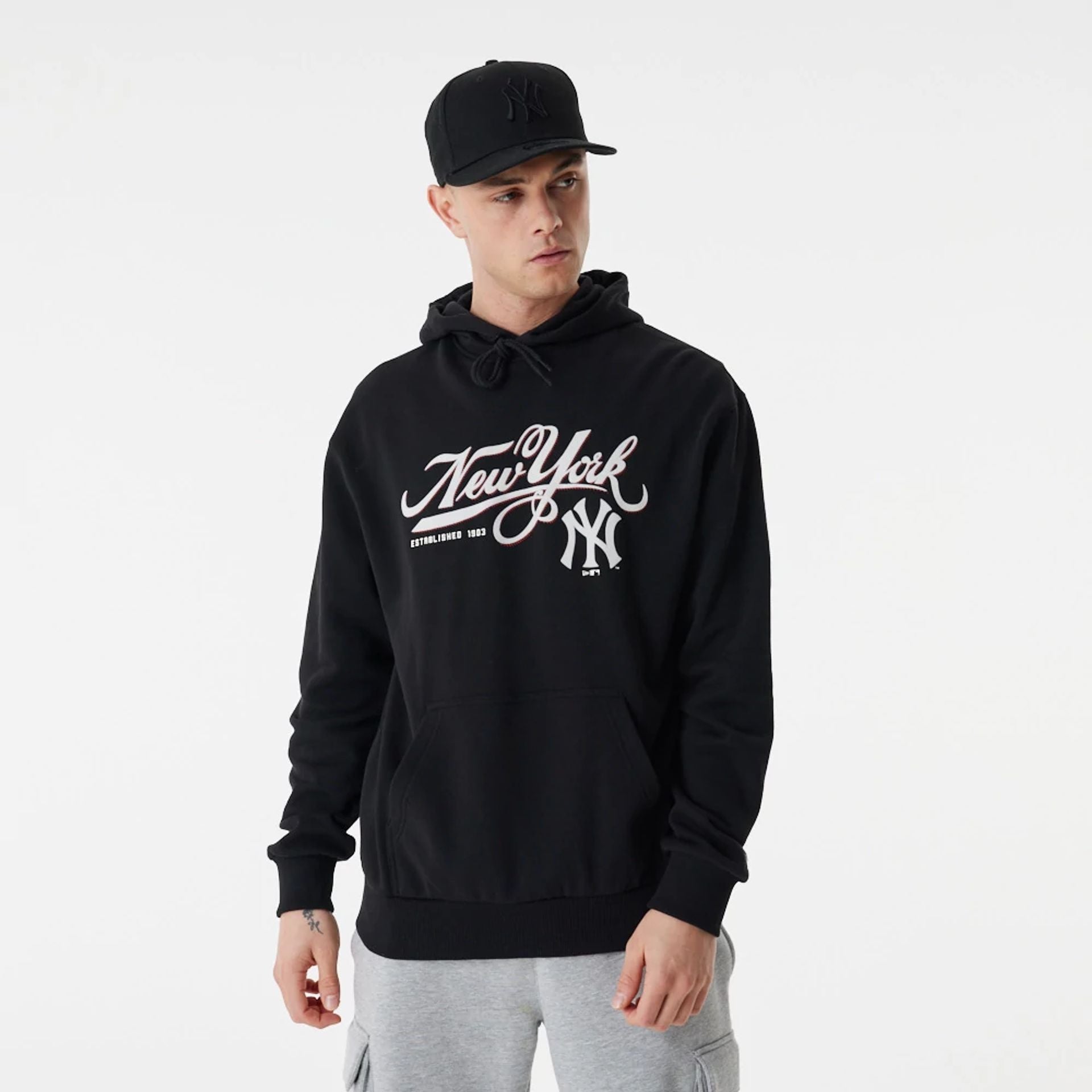 The Male model is wearing New York Yankees MLB Team Retro Graphic Black Oversized Hoodie 2