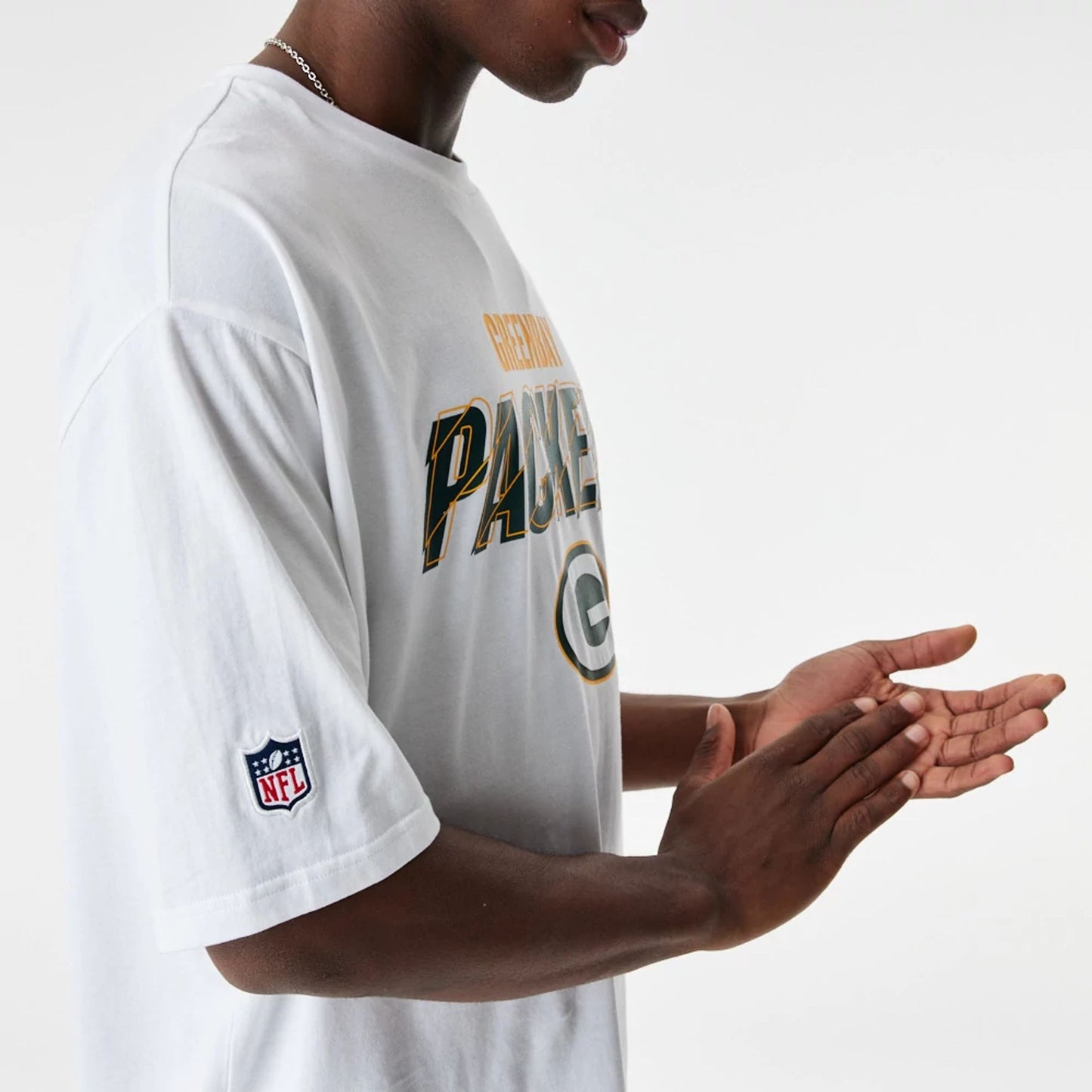 The Male model is wearing Green Bay Packers NFL Script Graphic White Oversized T-Shirt 3