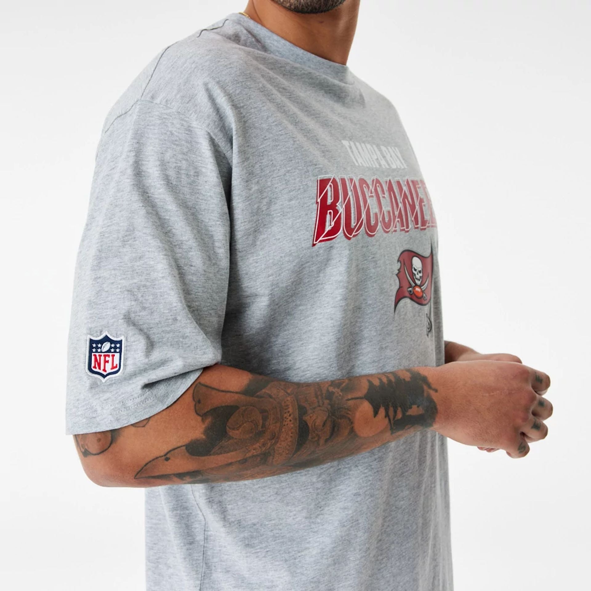 The Male model is wearing Tampa Bay Buccaneers NFL Script Graphic Grey Oversized T-Shirt 5