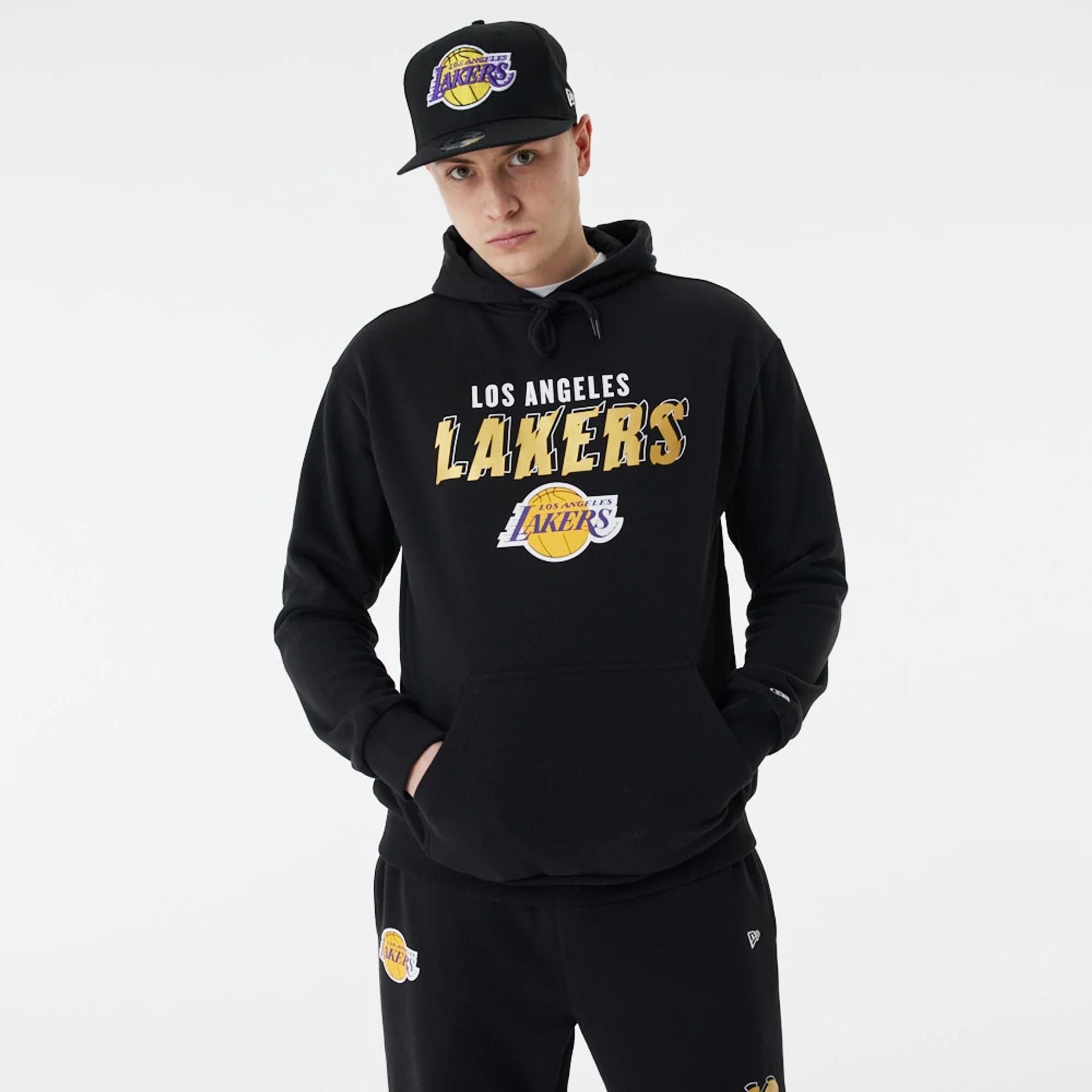 The Male model is wearing LA Lakers Team Script Black Oversized Hoodie 7